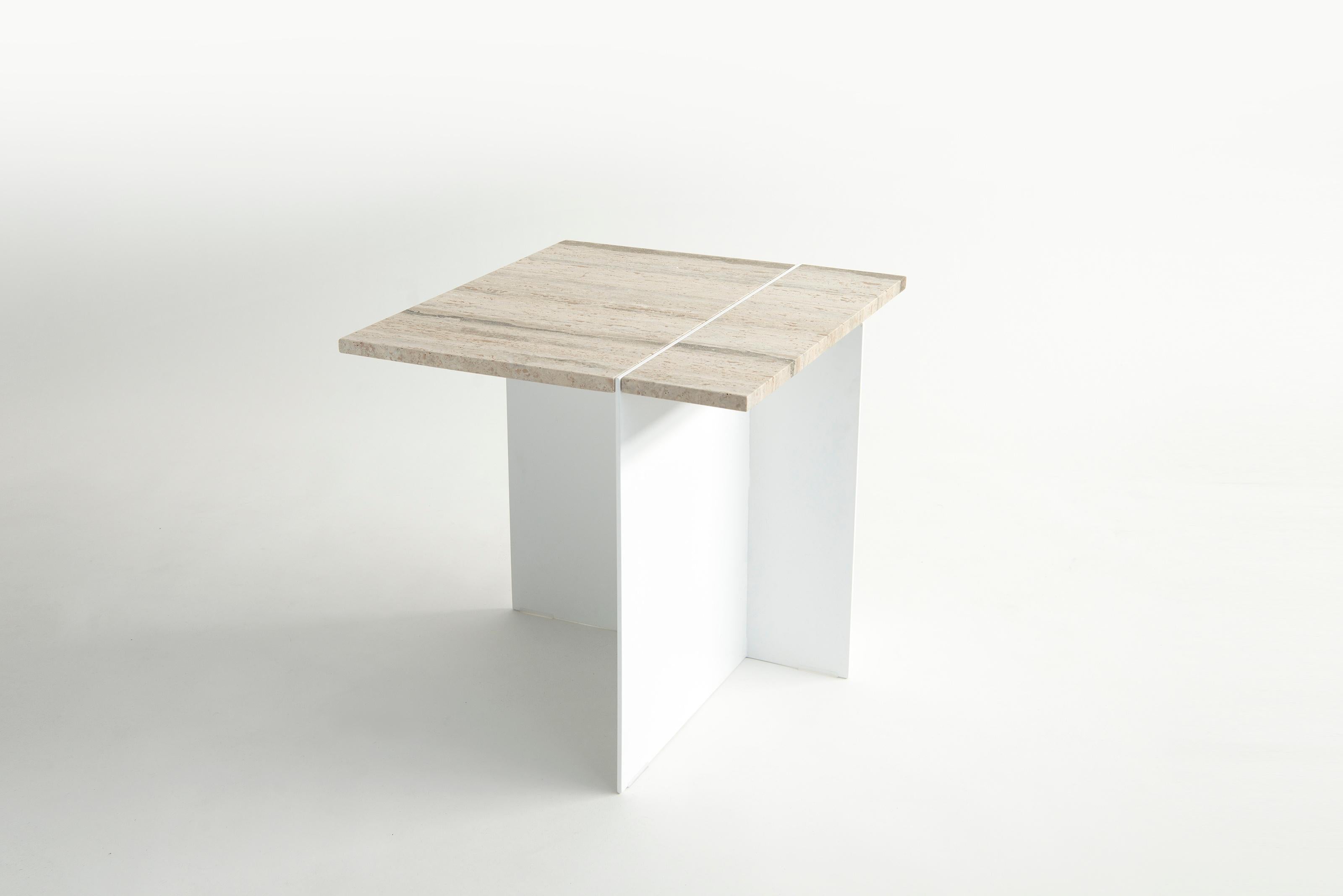 Listed price is for the Division Side Table with either a travertine, white carrara, or negro marquna top, and Flat Black or Flat White powder coat base. 

Collection of architecturally inspired side and coffee tables, fabricated out powder coated