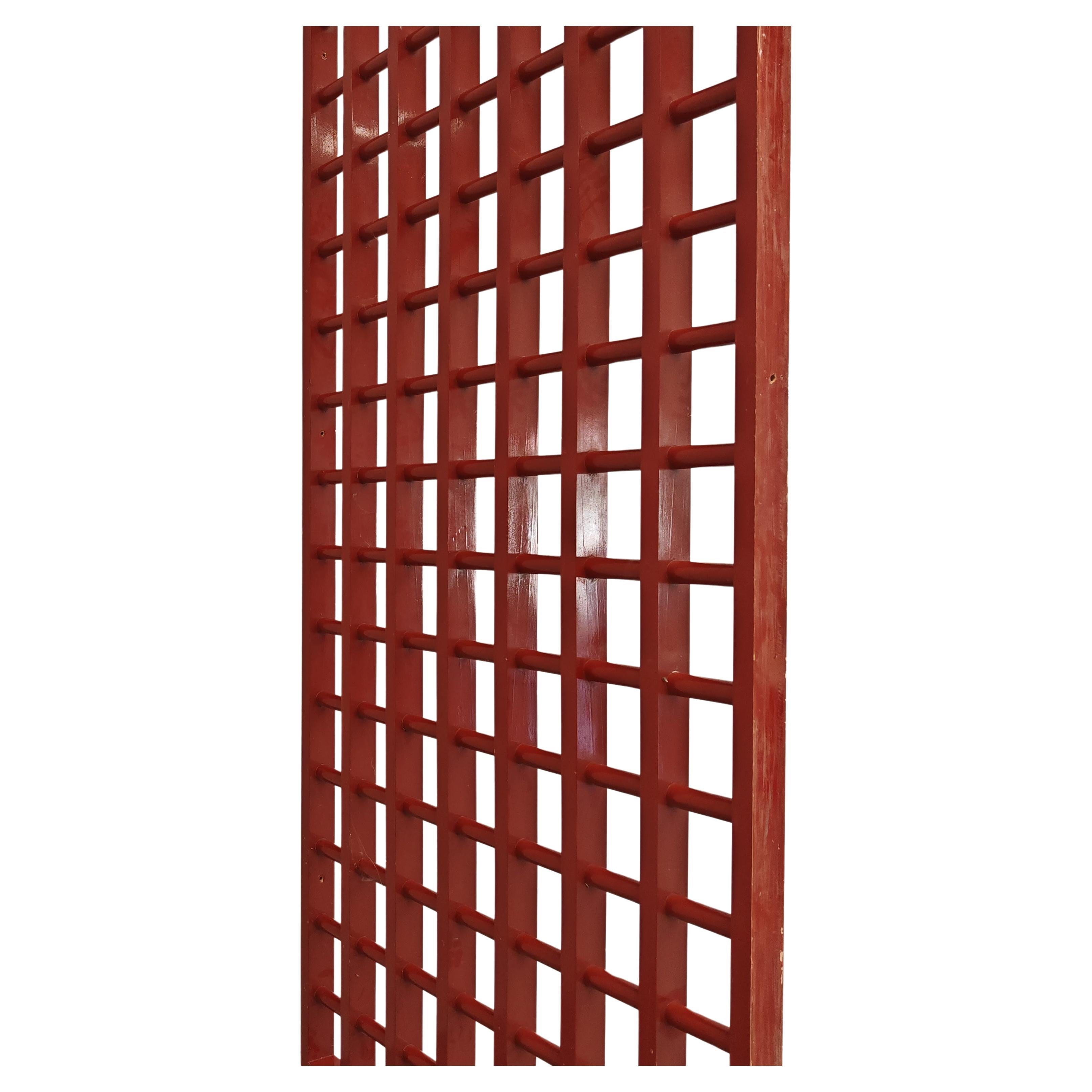 Large wooden dividers or partitions designed and made to an architect's design for abode in the early 1970s.
the structure is made of red lacquered wood. these structures can be anchored to the wall by means of fisher and are a striking solution for