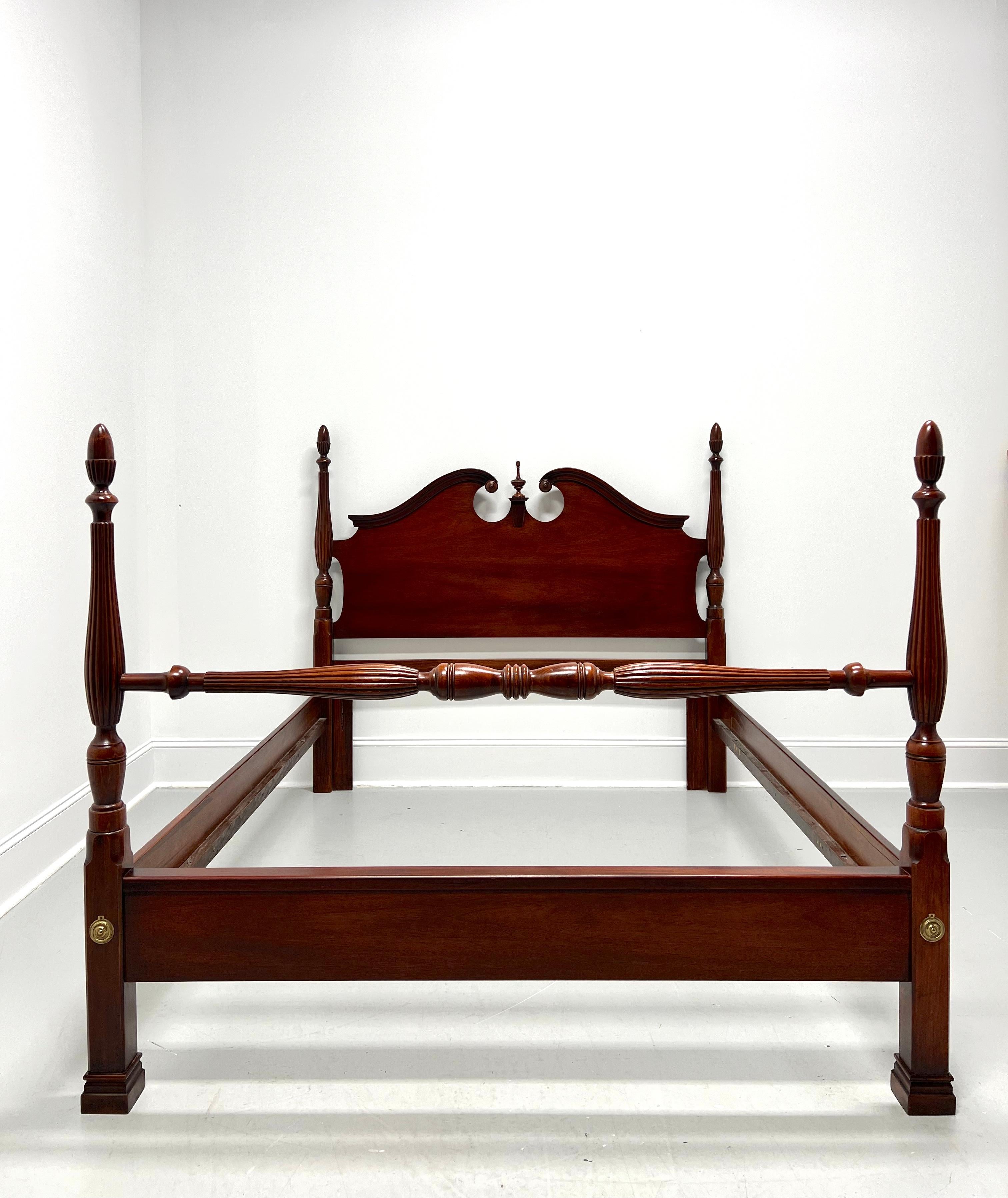 A Chippendale style queen size short poster bed by Dixie Furniture. Mahogany with carved pediment top to headboard & a center finial, fluted & turned upper rail to footboard, four fluted & turned short posts with finials, brass hardware, metal clip