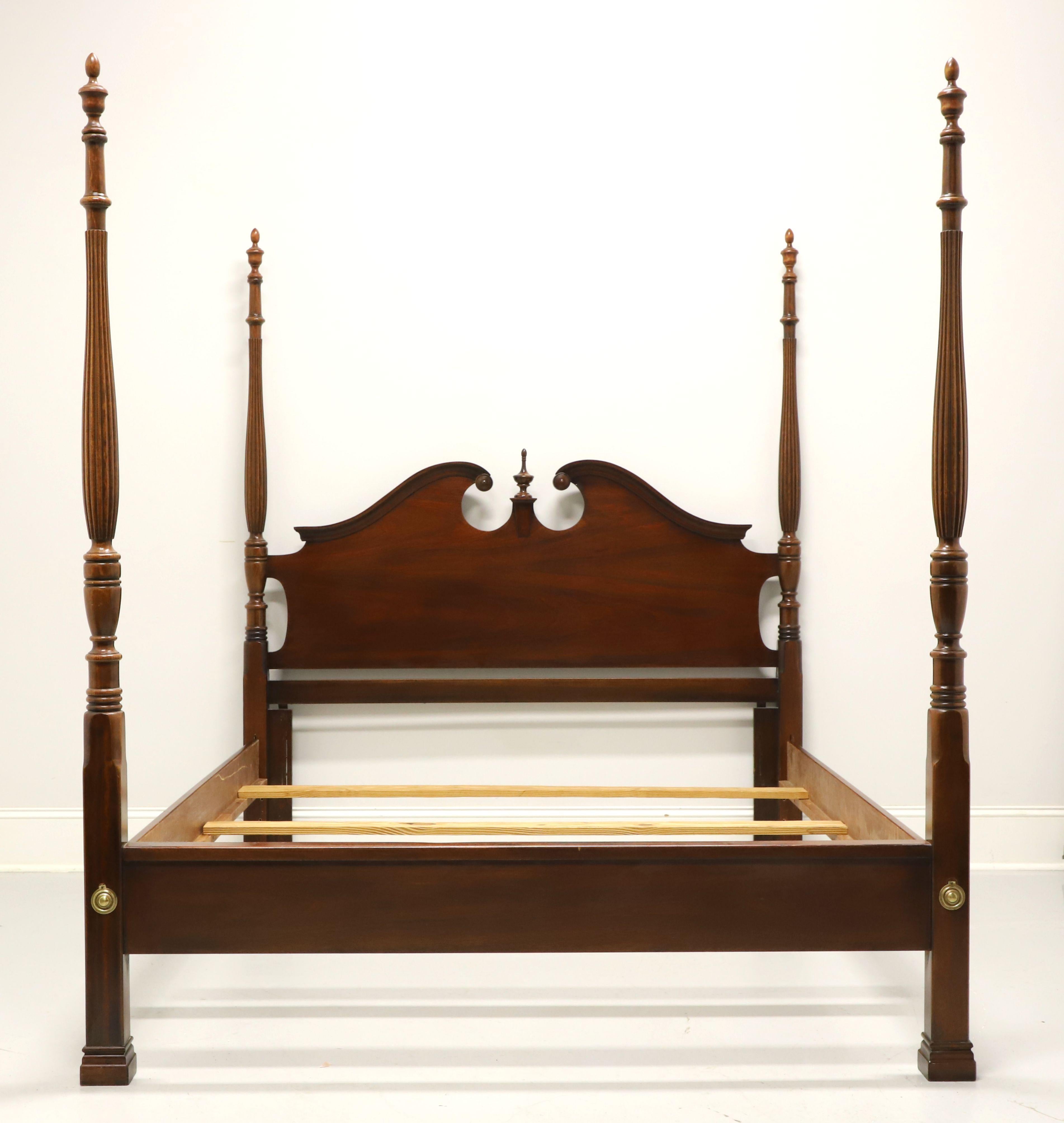 A Chippendale style queen size poster bed by Dixie Furniture. Mahogany with carved pediment top to headboard & center finial, four fluted & turned posts with finials, brass hardware, metal clip held side rails, and three wood slats for providing