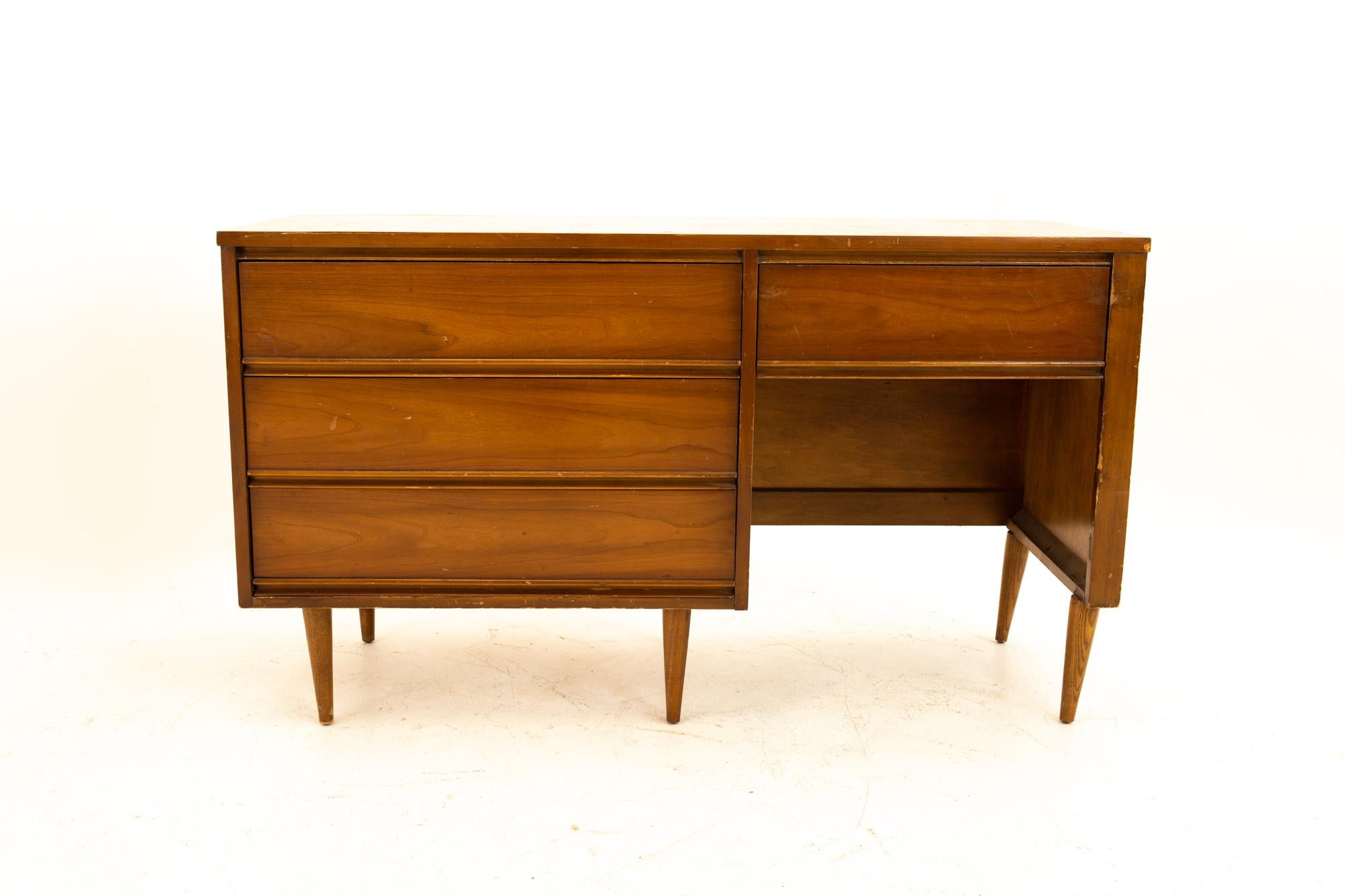 Dixie Mid Century 4-drawer walnut single sided desk
Desk measures: 52.5 wide x 19.5 deep x 30 high

All pieces of furniture can be had in what we call restored vintage condition. This means the piece is restored upon purchase so it’s free of