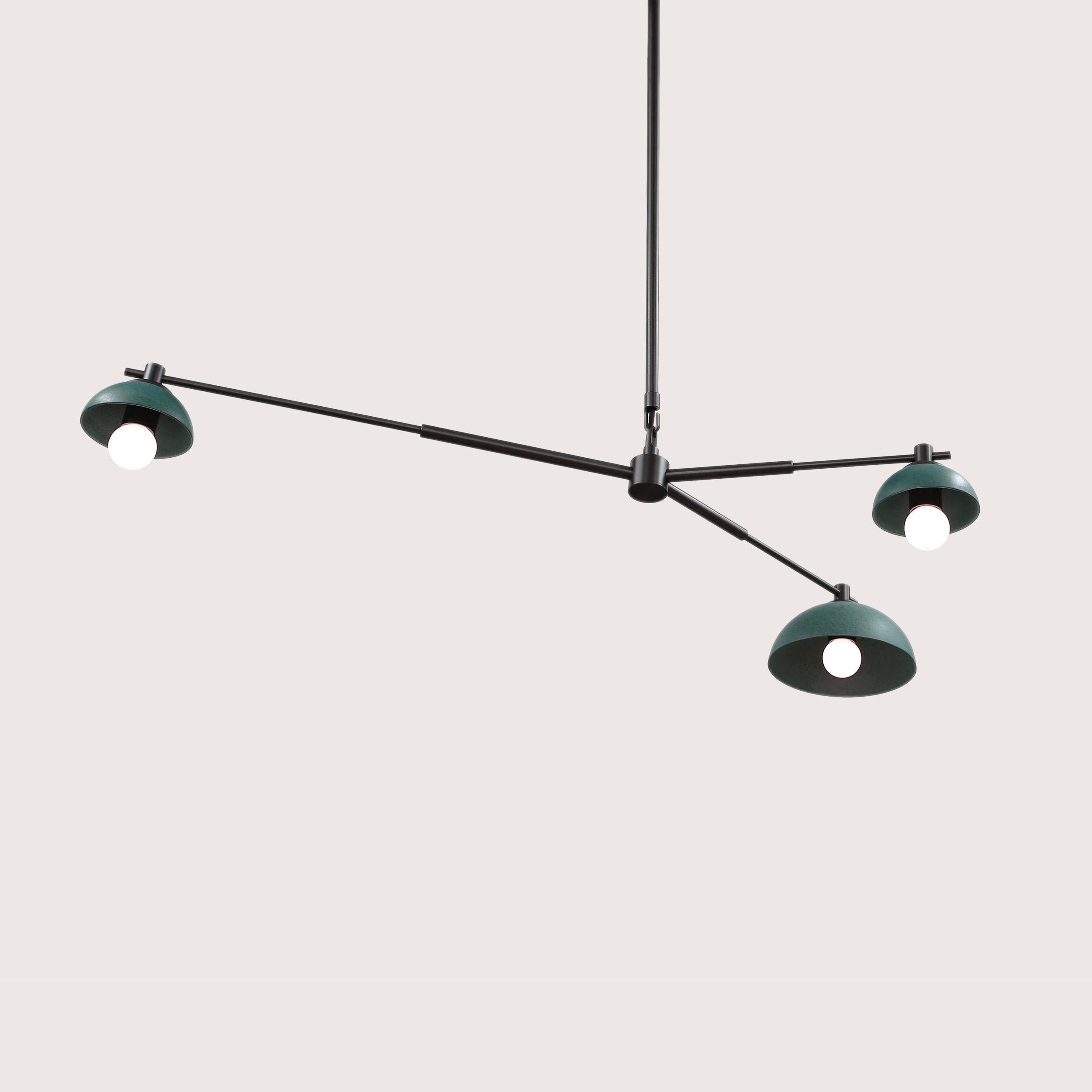 The Dixon ceiling fixture 3-light hangs at an angle with different sized terracotta reflectors for an exploration of balance and symmetry. The reflectors are hand-cast from terracotta and glazed with either a matte or textured lichen glaze. The