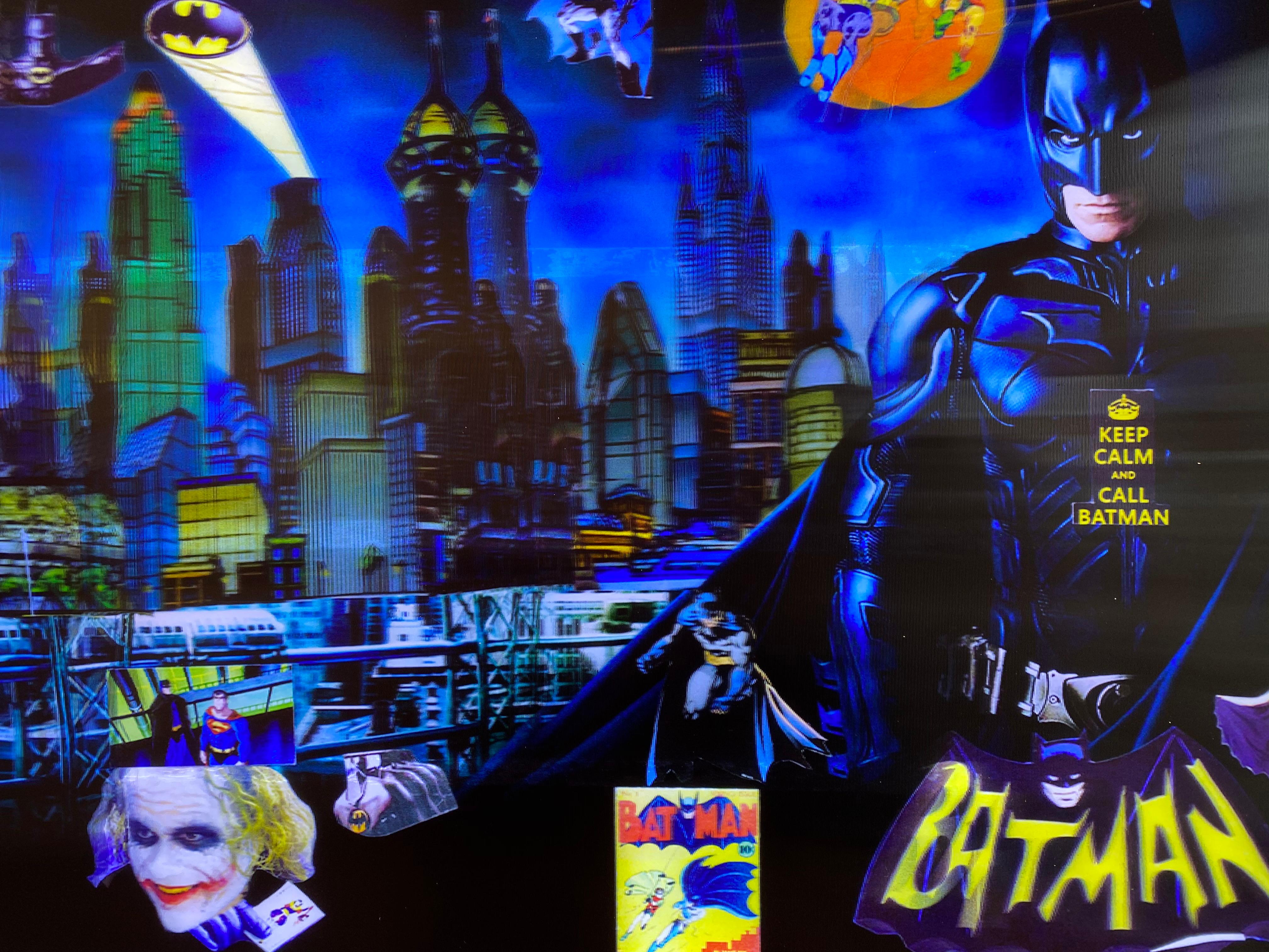 'Batman in Gotham' by DJ Leon, 2015. The piece measures 28 x 45 inches, Ed. of 10.  This 3D backlit print incorporates images and text found in batman comics. Embedded LEDs are placed behind the digital print to reveal three-dimensional images as