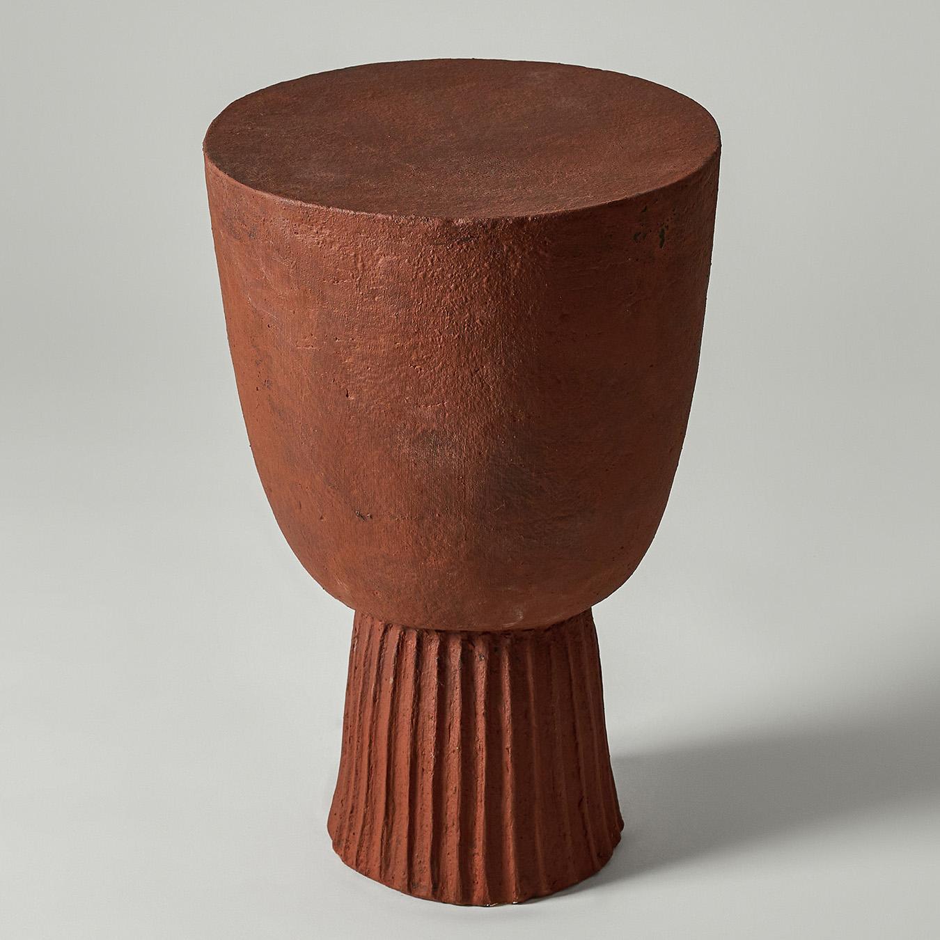 Djembe Side Table by Perler
Limited Edition
Dimensions: Ø 31 x H 48 cm.
Materials: Multiple-fired chamotte clay in a terracotta (reddish-brown) shade.
Weight: 13 kg.

The handcrafted Djembe side table draws its name from its resemblance to the