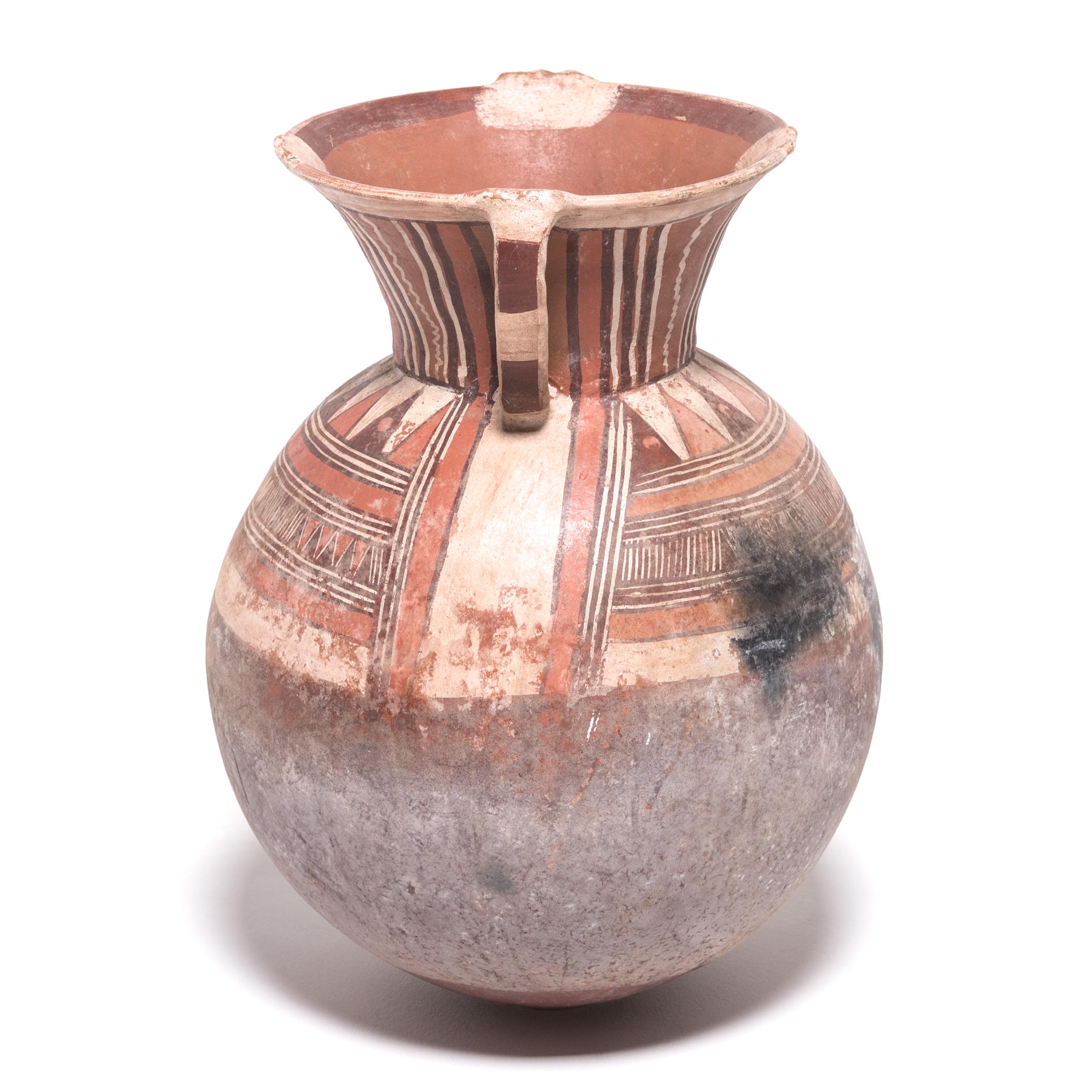 The Djerma people of Niger are well-known for their gracefully shaped and delicately painted water containers. The surface paintings are applied after firing with all natural pigments. The graphic, geometric designs closely relate to patterns that