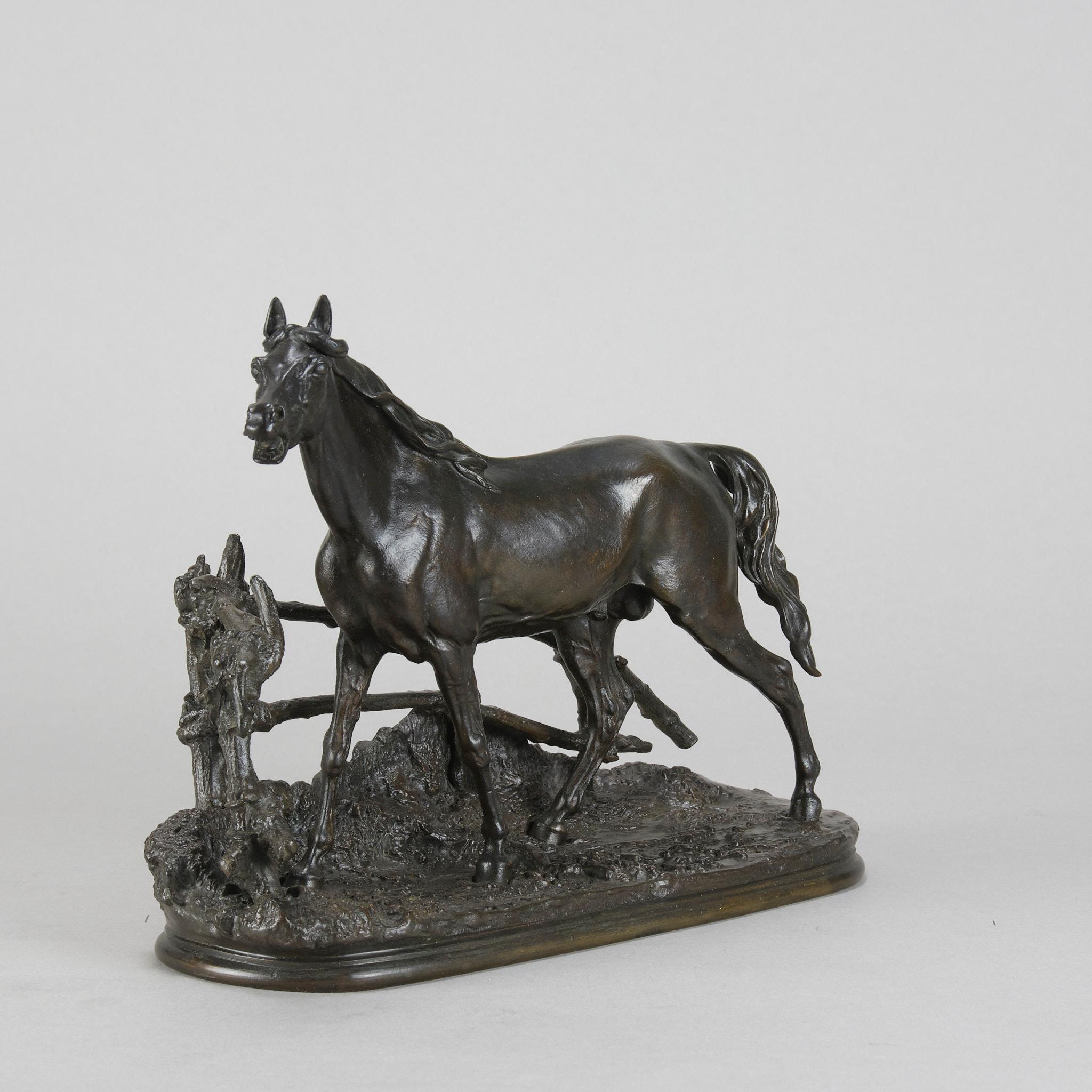 A very fine French Animaliers bronze study of a stallion standing behind a post and rail fence exhibiting excellent hand finished surface detail and good colour, entitled ‘Djinn Etlalon Barbe’, signed P.J Mêne

This model is the rare smaller size