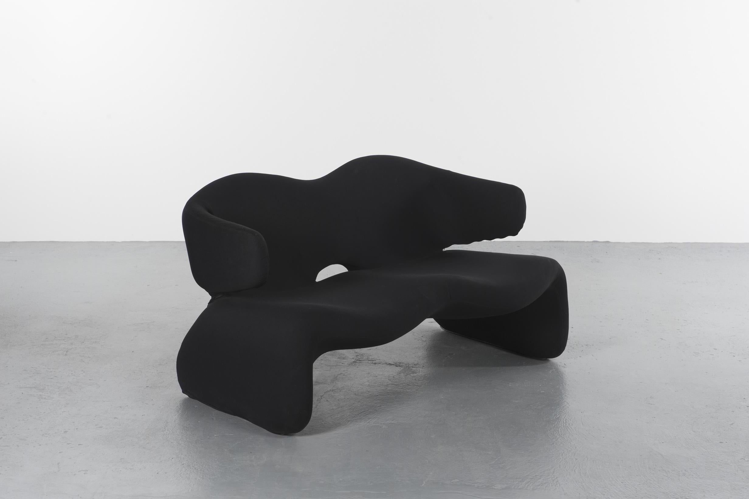 Djinn sofa by Olivier Mourgue, produced by Airborne, 1965, France

Sofa with balustrades made with a tubular structure with polyurethane foam covered with a black elastic jersey. 
Edited by Airborne from 1965-1976 

Currently exposed in the