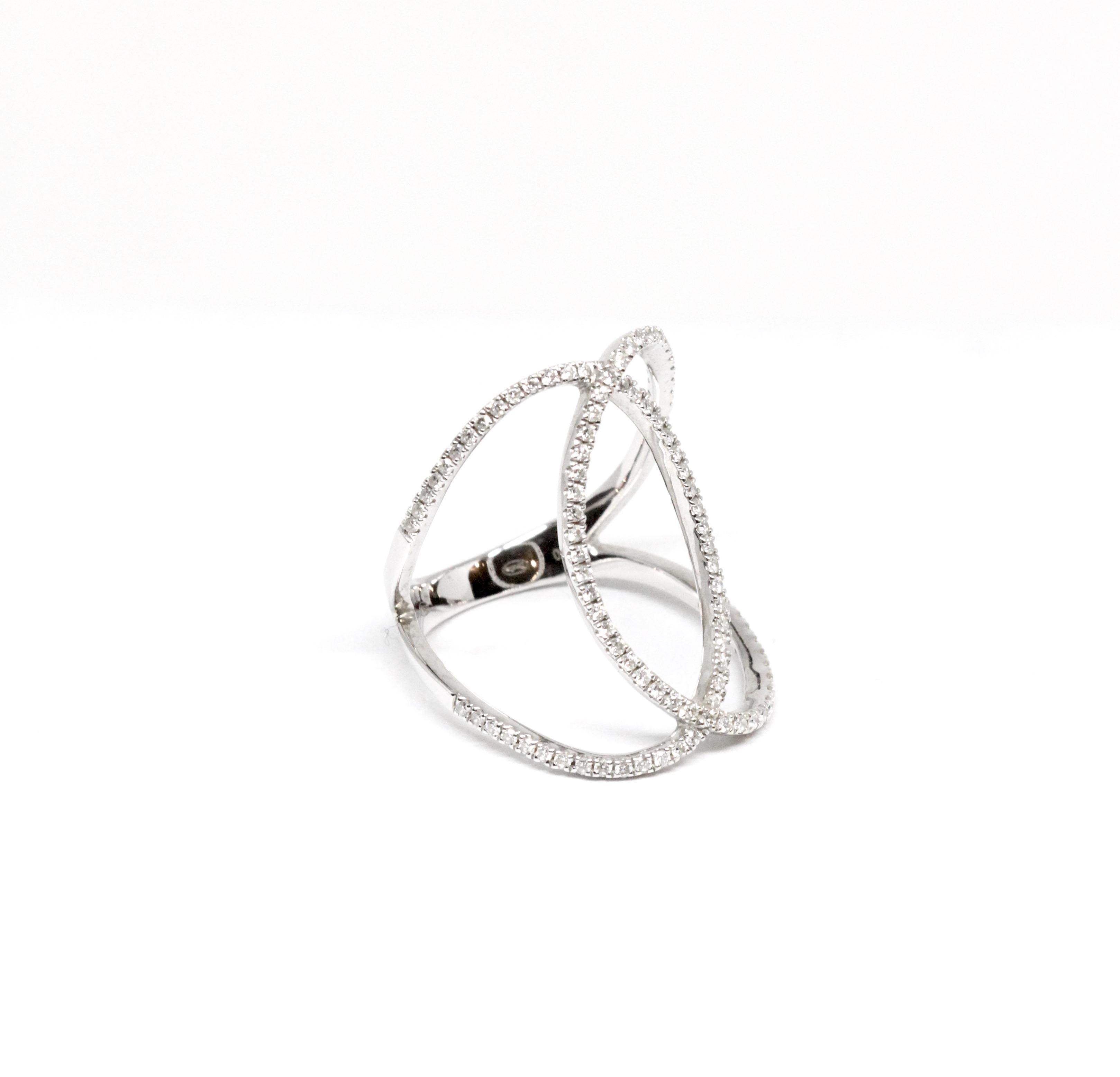 Designed by Alexandre Corrot for Djula, this pre-owned 18K white gold ring is hand crafted and set with diamonds.  
Diamond approx. 0.45cts
Weight approx. 4.25gr
Ring size 54 
