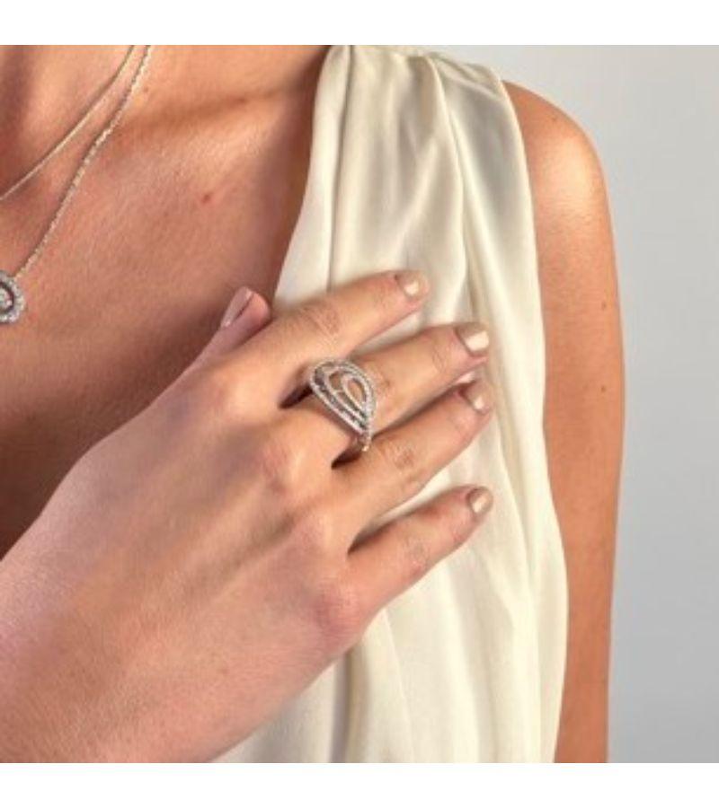 Ring signed the Djula house white gold 750 mils (18 carats). paved with round brilliant cut approximately 0.70 ct total of finger size: 53. width on front: 1.7 cm. total weight: 5 . 47 g. punched. excellent condition
