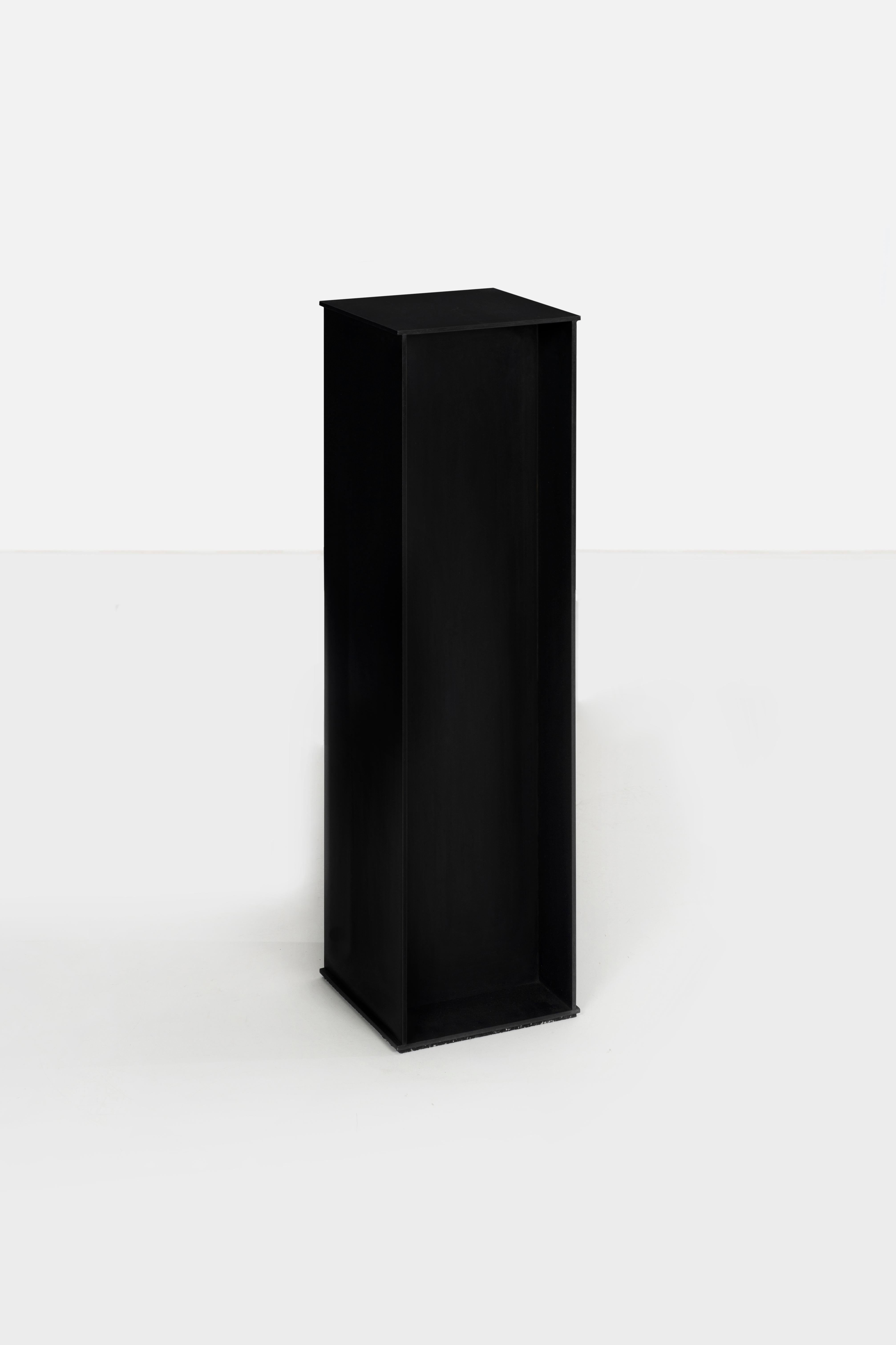 DK Pedestal in .25 inch thick aluminum plate that has been chemically blackened and waxed with black wax. Digitally cut aluminum plates are precisely welded and finished. The pedestal has a digitally-cut rubber recessed footpad.
