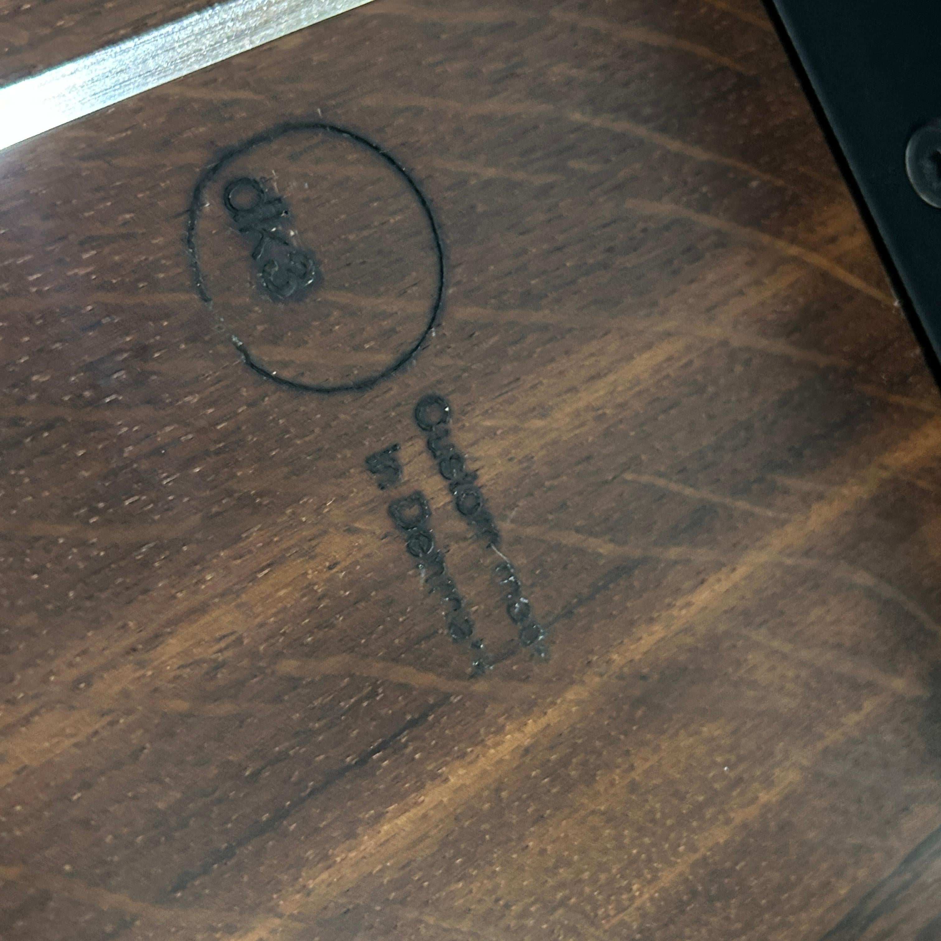 Introducing the Lowlight Dining Table by Jacob Plejdrup for DK3 - a masterful blend of craftsmanship, design, and sophistication. This elegant table showcases a sleek silhouette with a solid wood top and refined metal base, embodying both durability