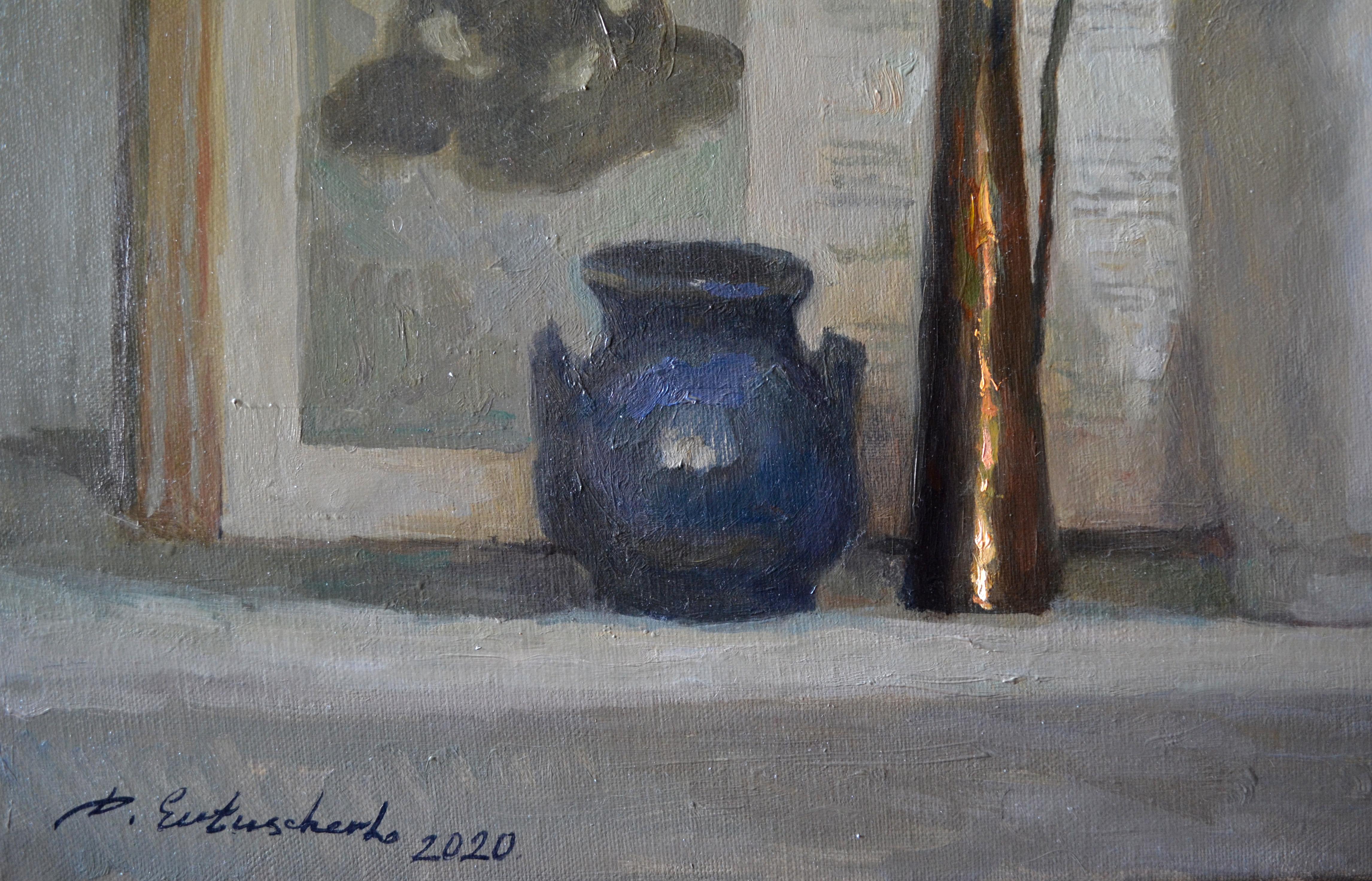 The still life is done in light colors, in gentle neutral pearl-silver shades. The background for the objects is an open large album with Japanese prints. We see two reproductions with characteristic images of a man and a woman. The objects, for