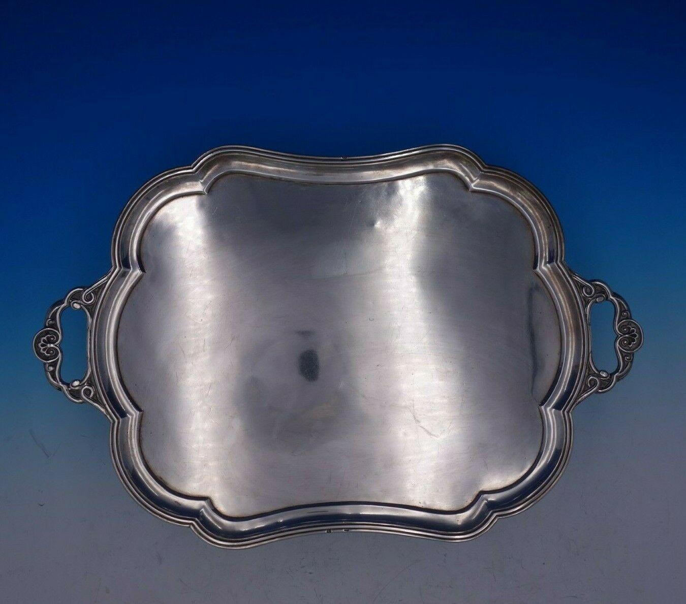 Dmitry Orlov

Wonderful Dmitry Orlov Russian .84 silver serving tray with shell handles and scalloped border. This piece was made in Moscow in 1868.

The tray measures 19 7/8