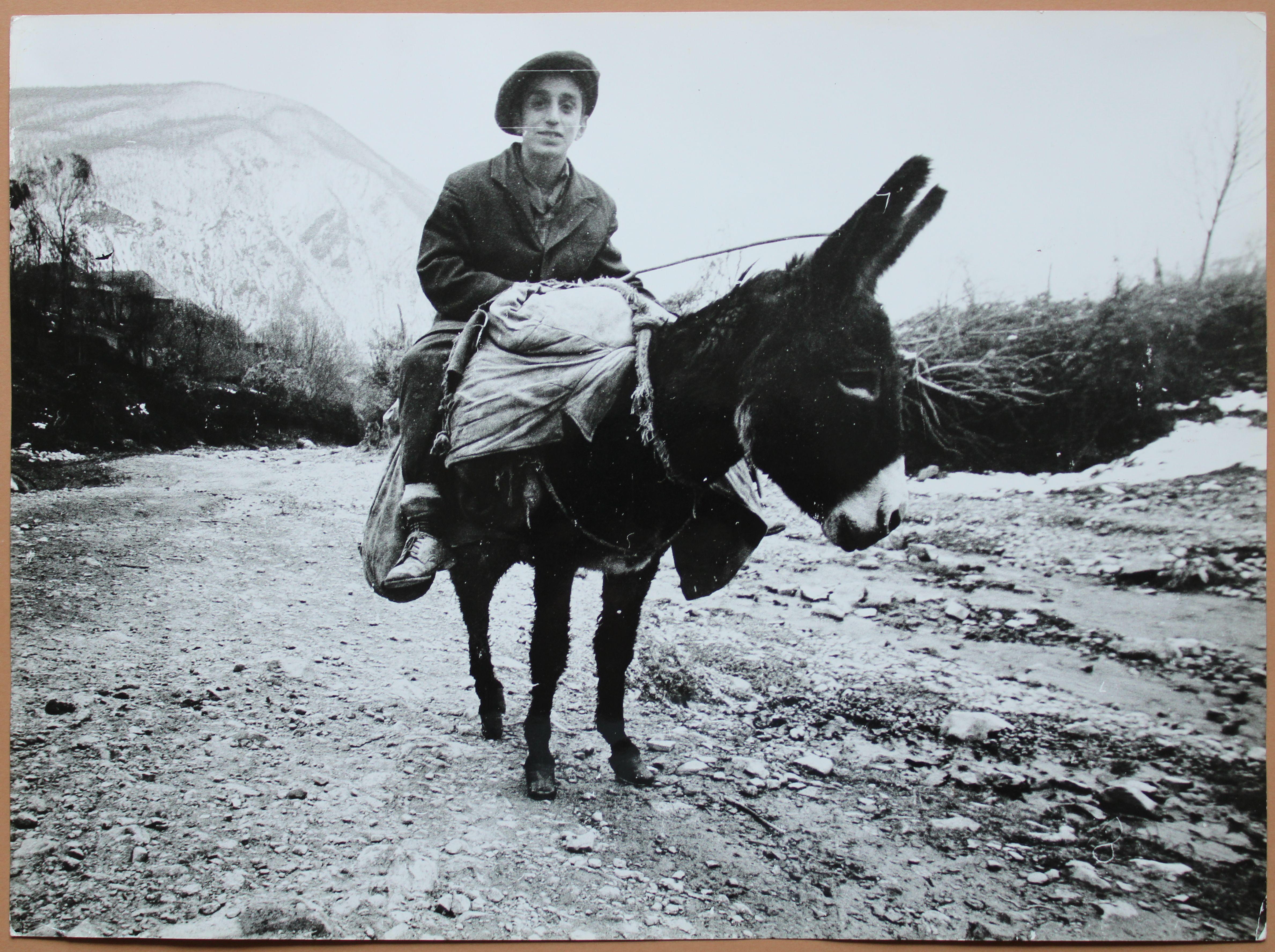 Photography by Dmitry Zyubritsky Boy on the donkey at mountains. 1979. Size 30x40 cm