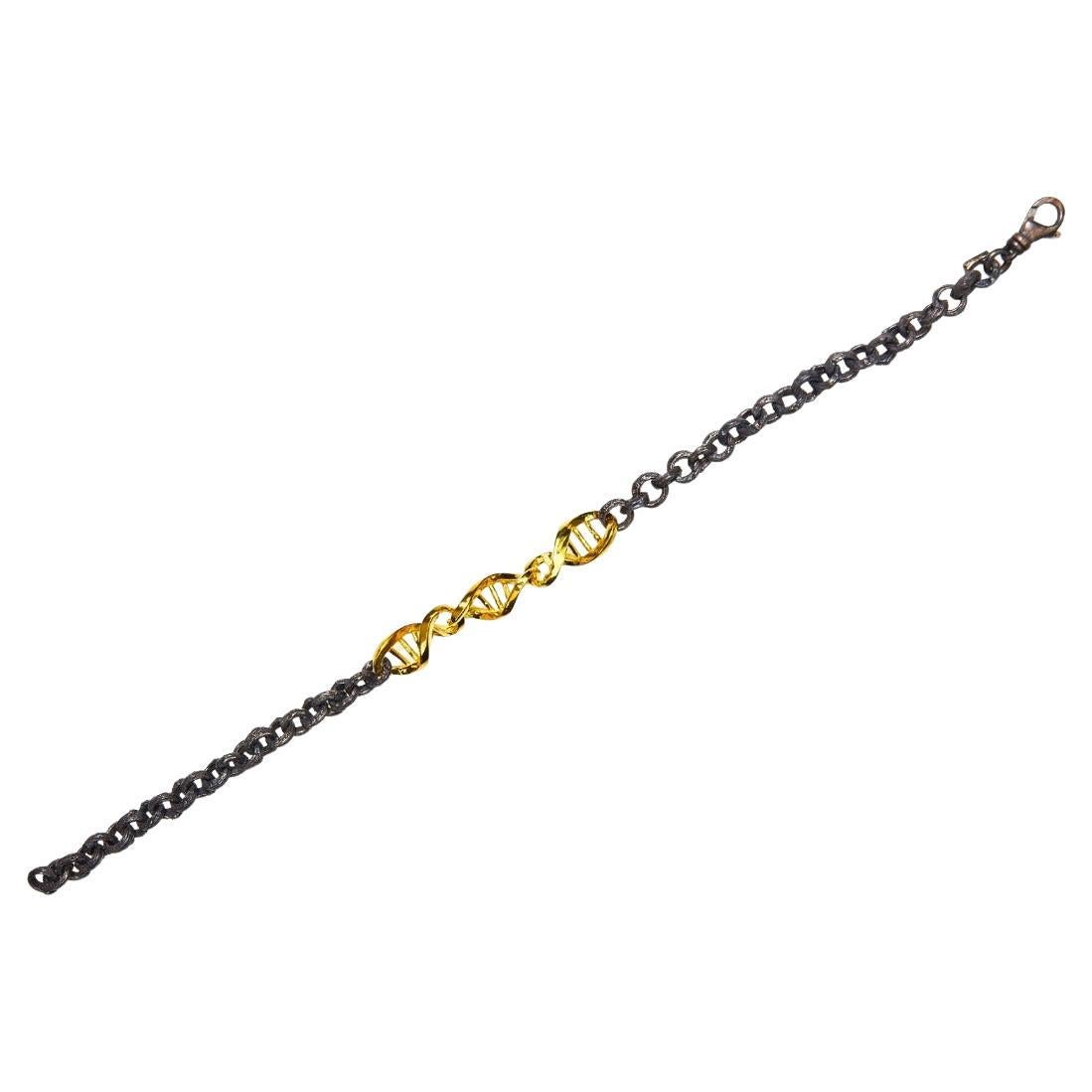 Pulsera DNA para caballero en oro de 18 quilates y plata de ley negra oxidada en venta