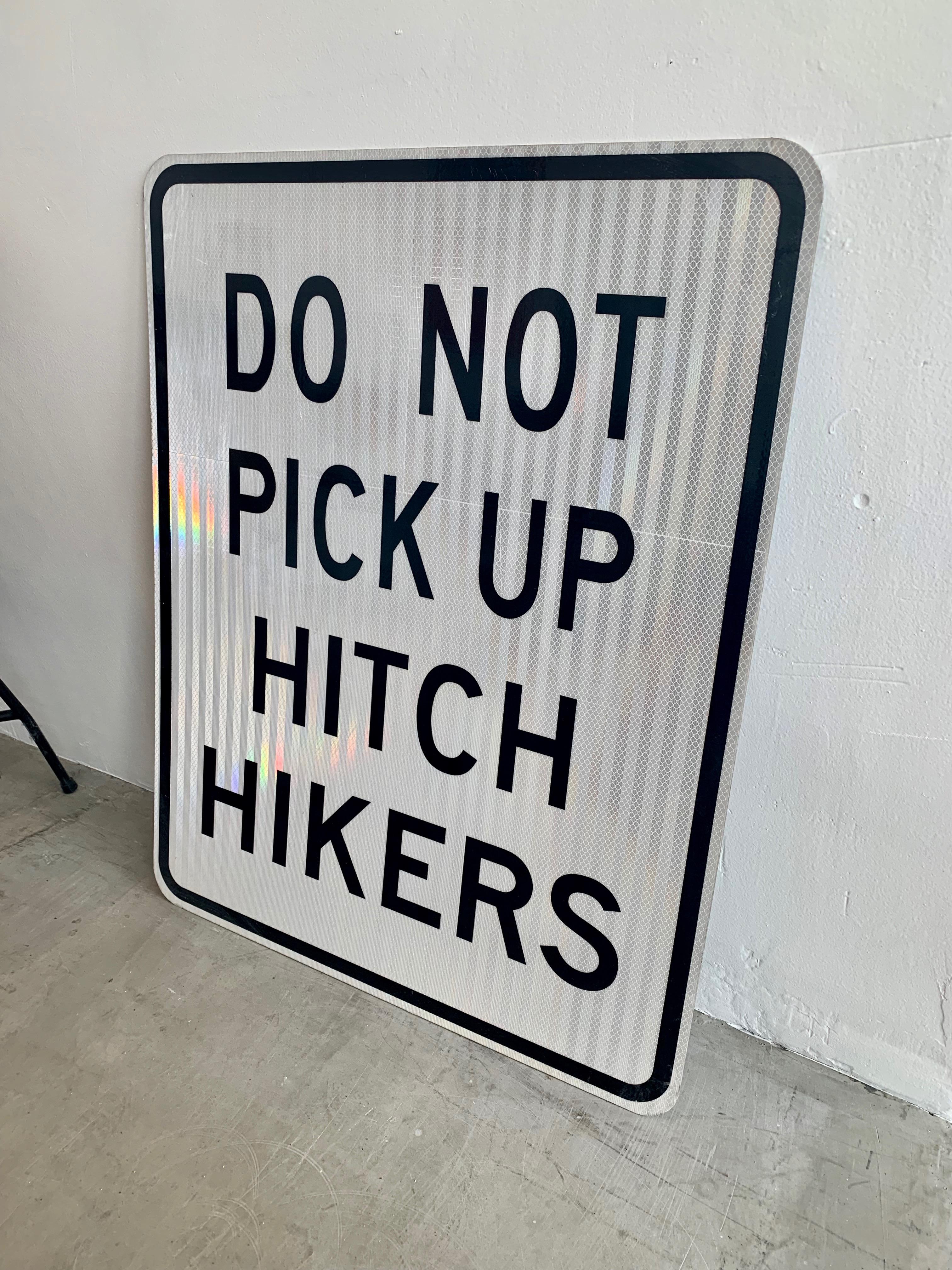 do not pick up hitchhikers sign meaning