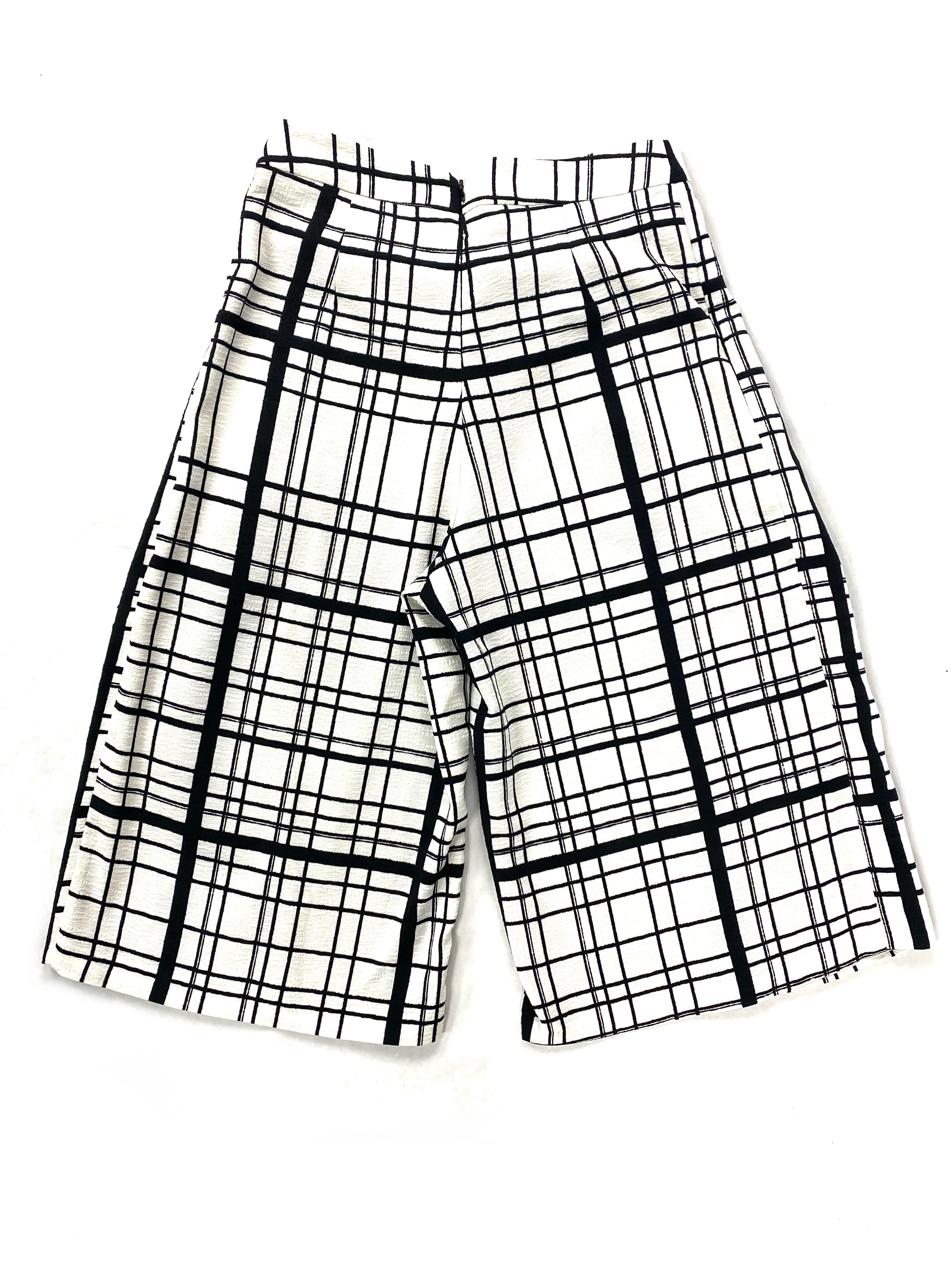 Product details:

The pants feature black and white plaid pattern, wide leg (12 inches across) and high waisted.