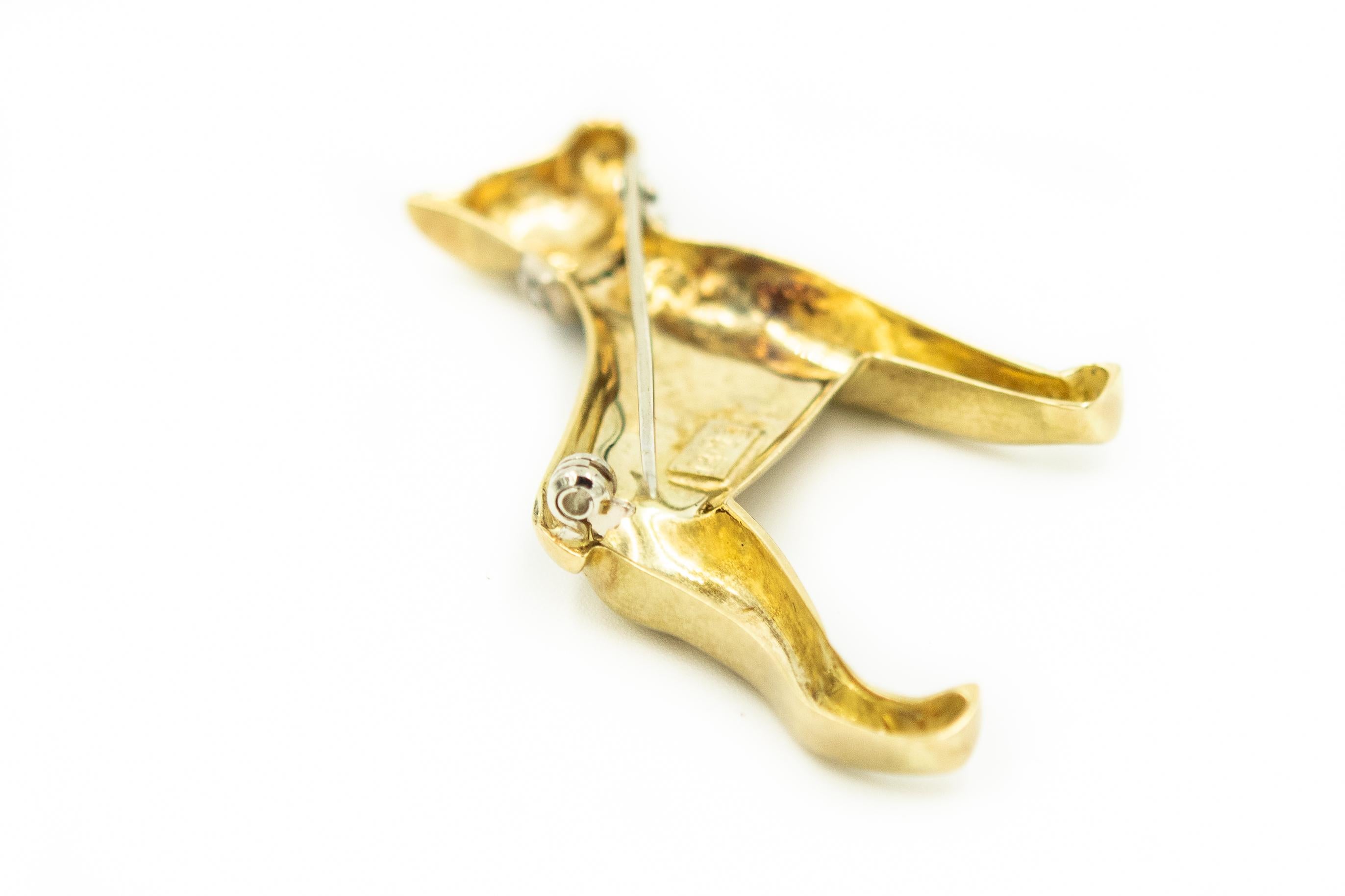 Finely made Italian Doberman Pinscher dog brooch made of 14k yellow gold with a satin finish accented with diamond collar.  The brooch is marked Italy 14k  AU.