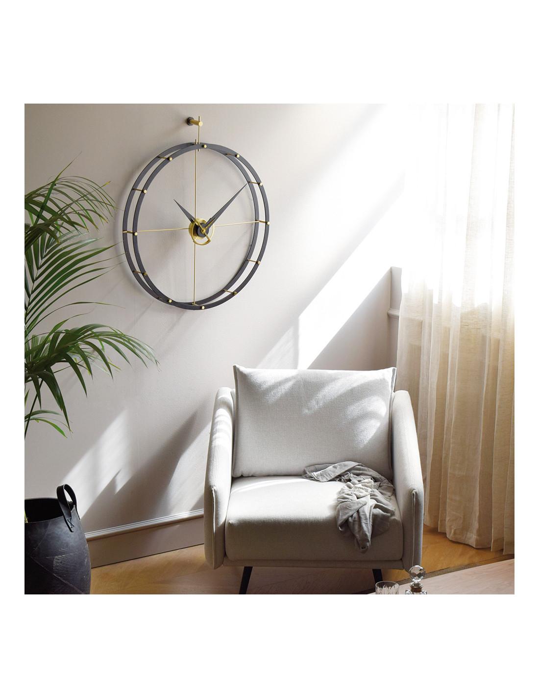 This elegant designer clock presents a diameter of 70 centimeters and a height of 80 cm that covers any space with elegance.
Doble O NG wall clock: Rings and hands in wenge wood with brass details
Not OK for Outdoor Use
Warranty: 1 year
Each