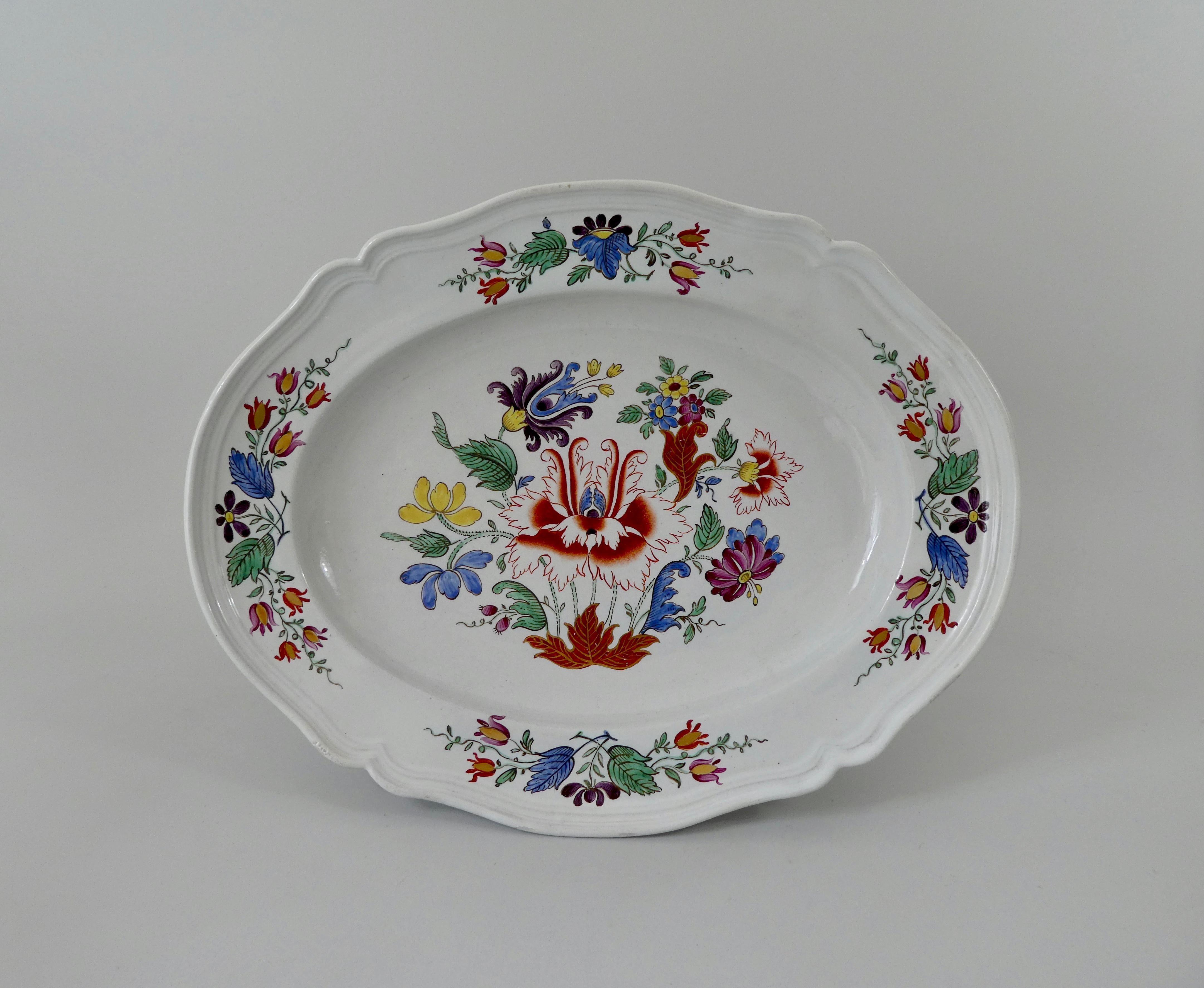 A fine Doccia Porcelain tureen cover and stand, circa 1770, Lorenzo Ginori factory. The silver shaped tureen hand painted in polychrome enamels, with the Tulipano pattern, of stylised flowering plants. Having a similarly decorated shaped under