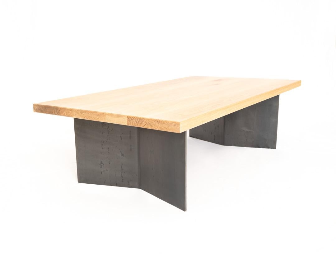 A mix of modern and Industrial design, the Dock Coffee table features white oak and raw steel. The top is hand-joined and glued from sustainable white oak and features a chamfered edge. The base is constructed from 1/4 inch hot rolled plate steel