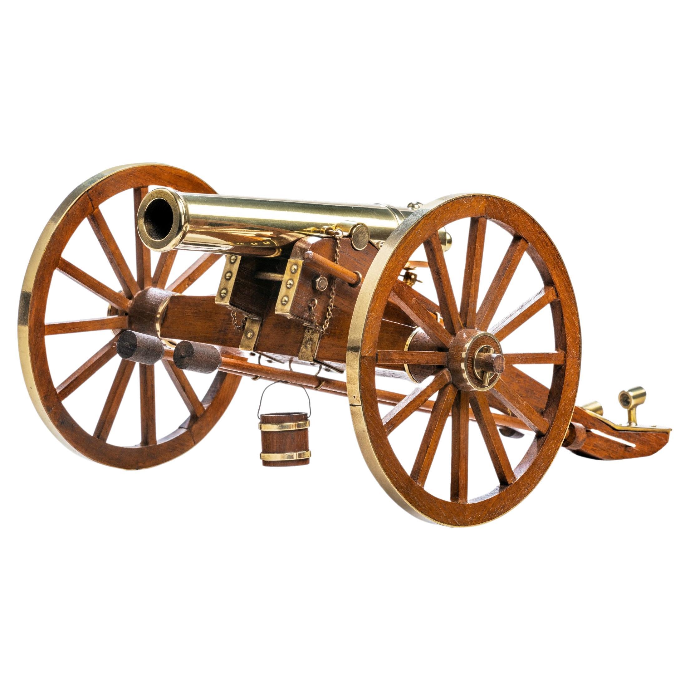 A model of a Dockyard built teak and brass field cannon For Sale