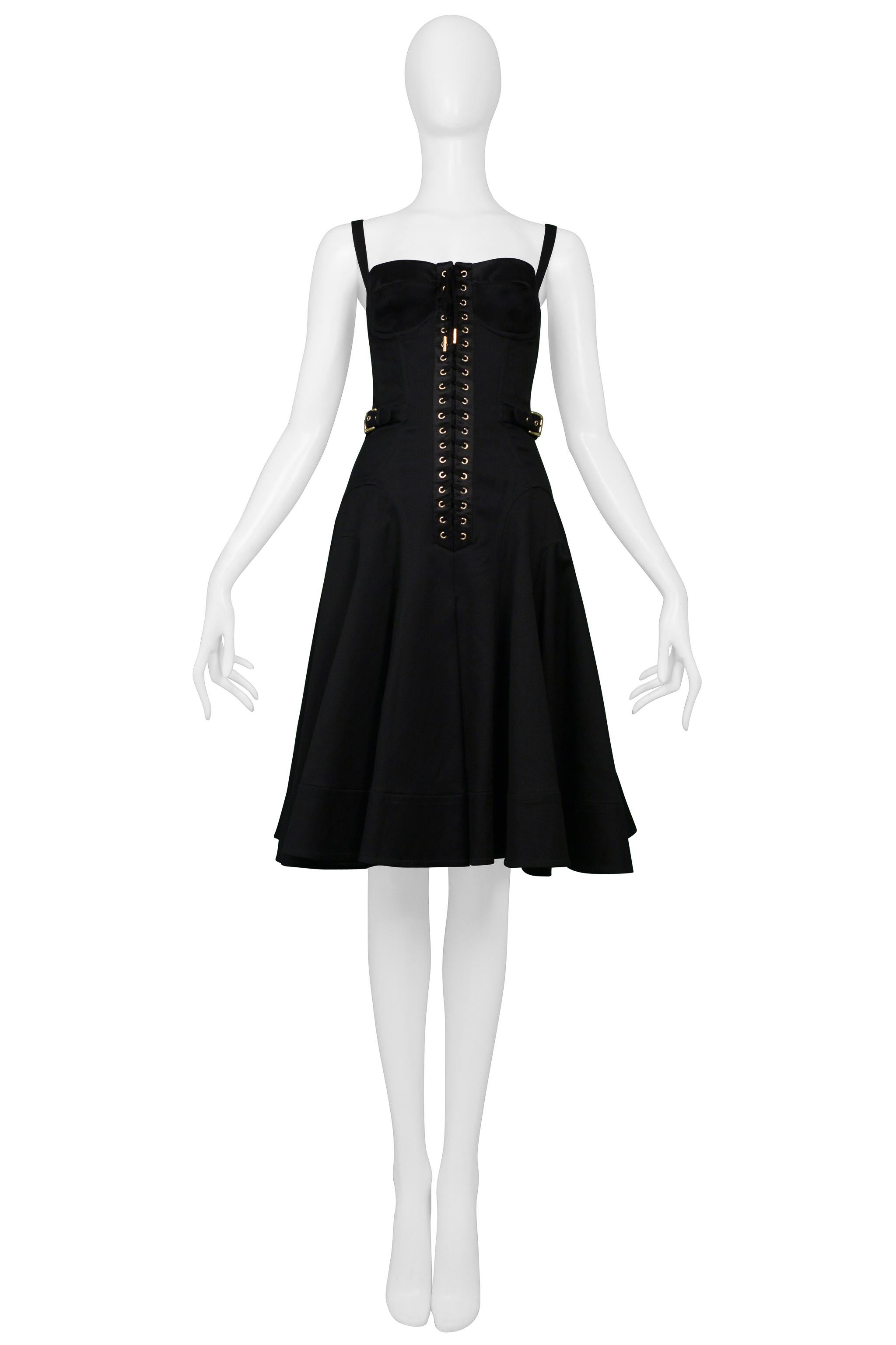 Resurrection Vintage is excited to offer a vintage Dolce & Gabbana black sundress dress featuring a front corset panel with laces, bra cups, classic straps, gold adjustable buckles at the sides, a center back zipper, and knee-length. 

Dolce &