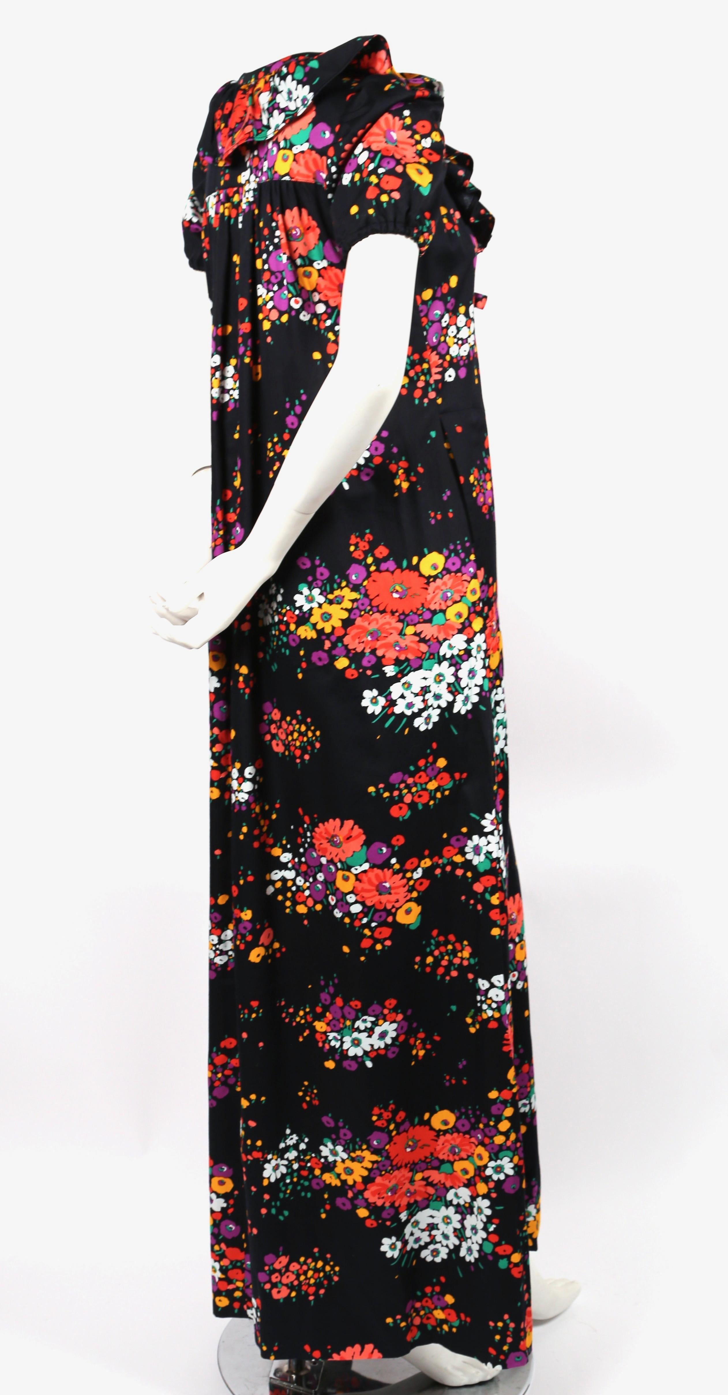 Black, floral-printed, cotton gown with flounce detail and long tie designed by Yves Saint Laurent for Saint Laurent rive gauche dating to 1974 exactly as featured in the Saint Laurent ad campaign as photographed by Jean Jacques Bugat. French size