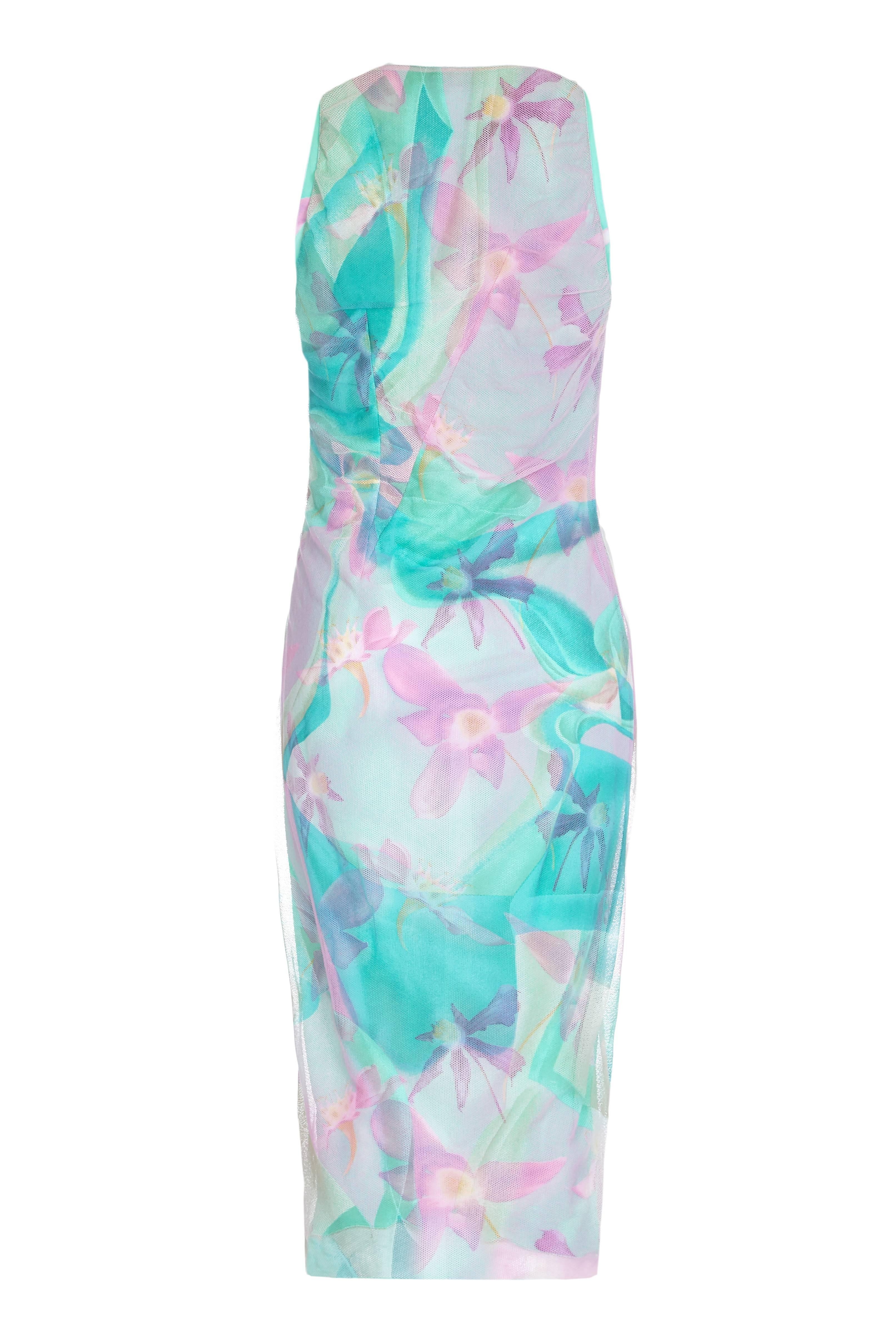 1999 Gianni Versace couture turquoise and pink layered net dress.  This stretch dress has a jersey floral printed under layer with a net overlay that has a more abstract print.  It is asymmetrically cut with gathers to one side, a cowl neck and an