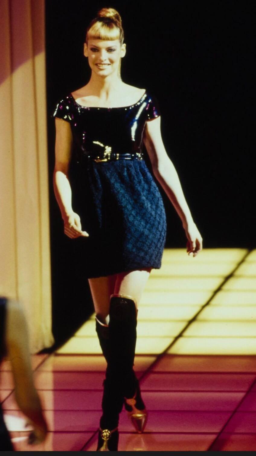 Documented rare GIANNI VERSACE COUTURE Fall/Winter 1994 runway dress! Linda Evangelista strutted down the runway in this beauty (see photo). Fitted PVC fitted bodice looks like patent leather, and has cap sleeves. Wool boucle skirt, and detachable