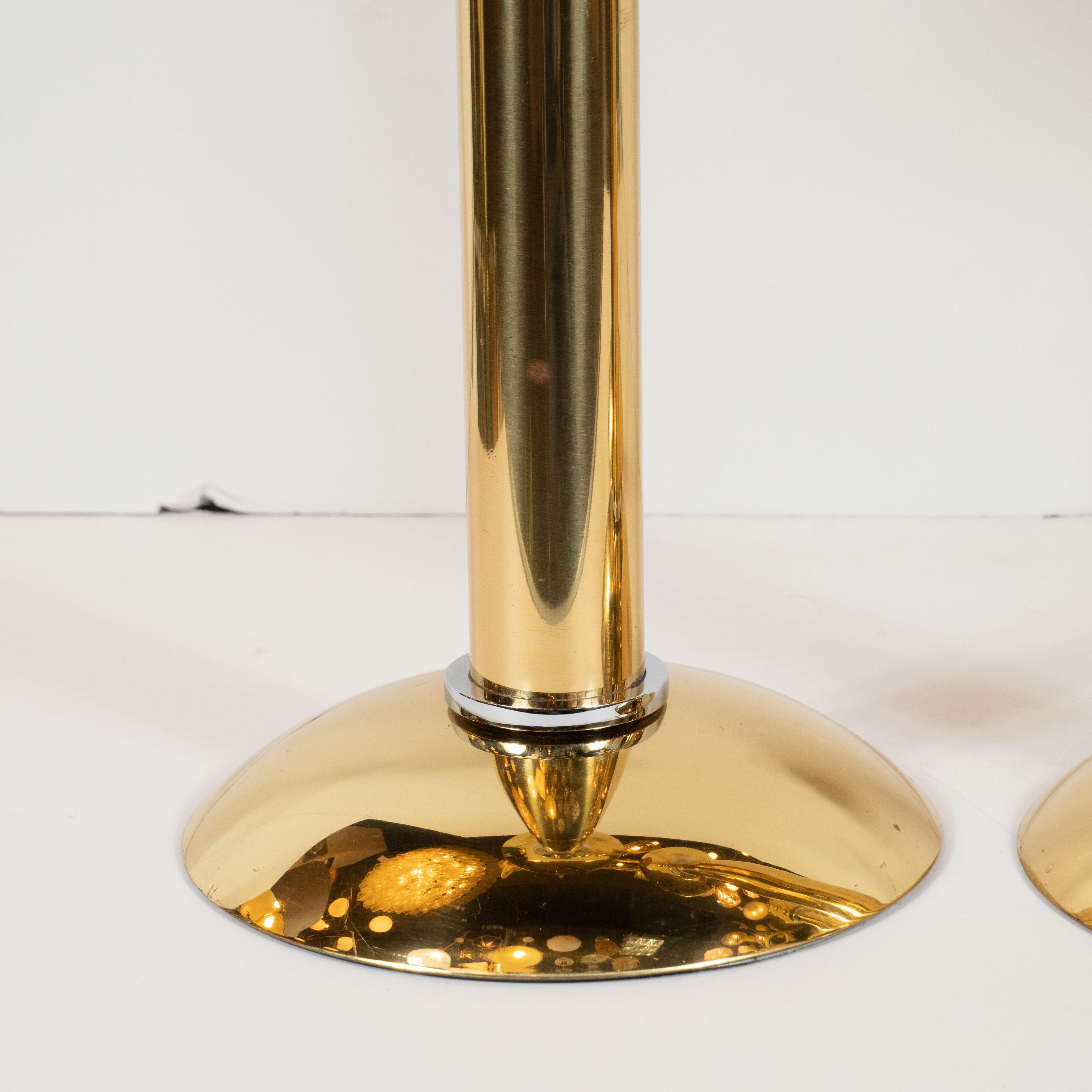 This stunning and dramatic set of candlesticks were realized by Karl Springer- one of the most influential and important designers of the 20th century- in America, circa 1985. It features a concave base and a convex top connected by a cylindrical