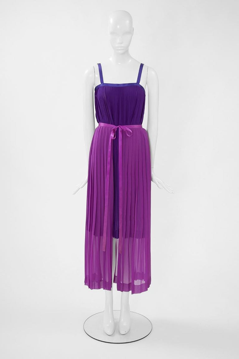 A wonderful addition to any summer wardrobe, this SS1979 runway Yves Saint Laurent Rive Gauche color block two-pieces can be worn both together and separately. Composed of a vibrant purple dress and a mauve overskirt, both pieces are cut from