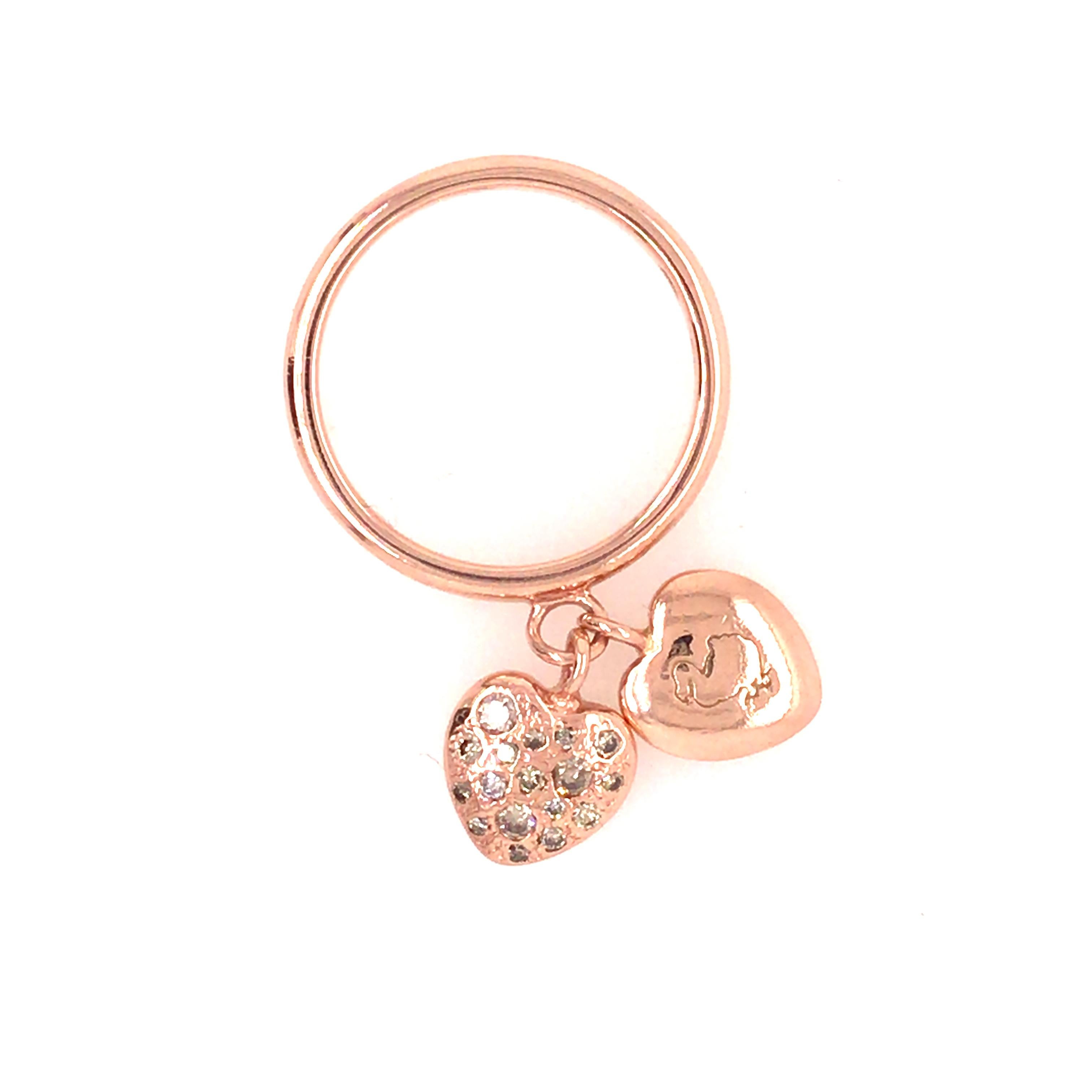 Dodo Pomellato Pave Heart Charms Ring in 9K Rose Gold.  (18) Round Brilliant Cut Diamonds weighing 0.18 carat total weight, J-K in color and SI-I1 in clarity are expertly pave set in one heart charm.  Ring size 6 3/4, 4.82 grams.  
Inscribed: 375,