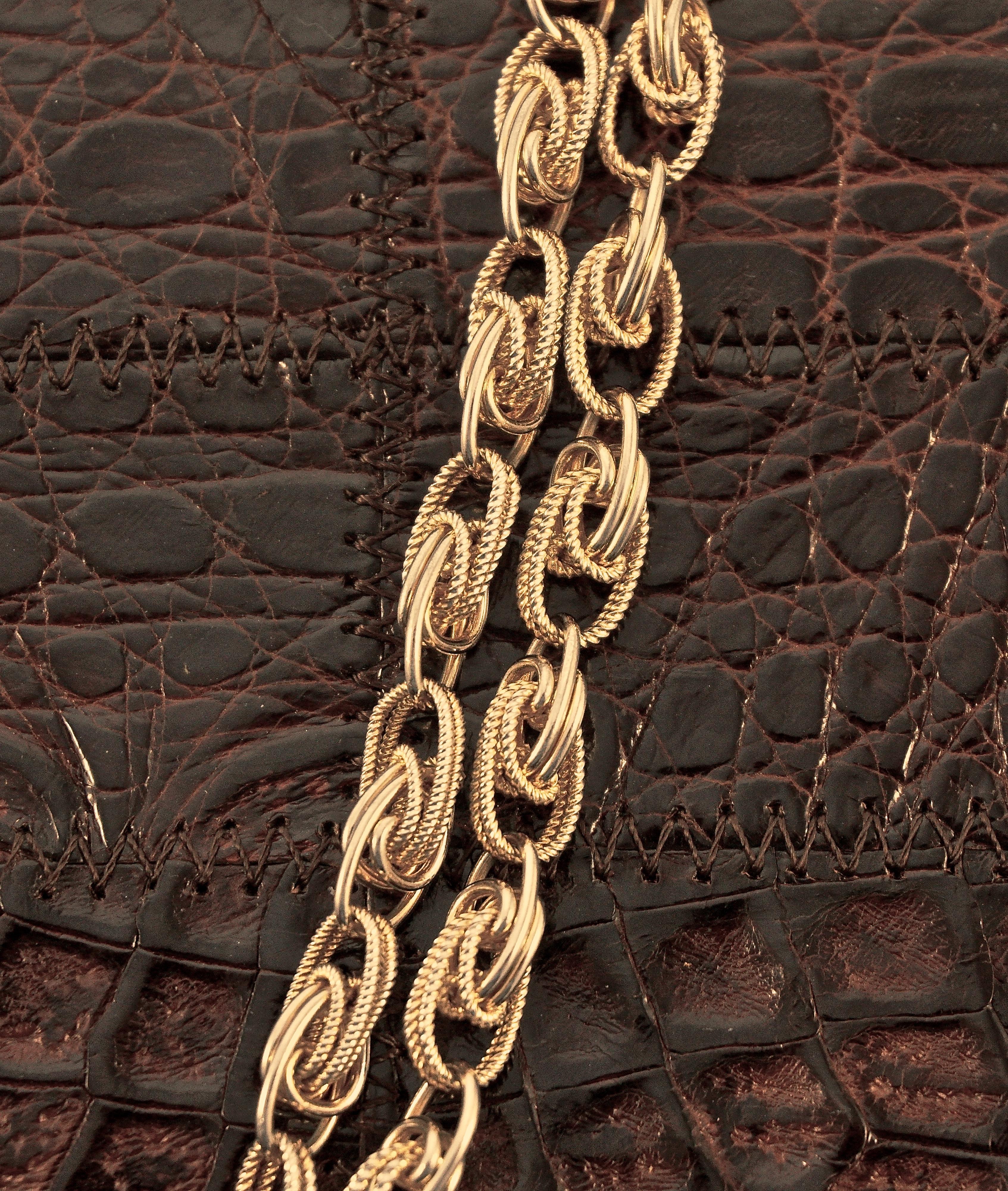 Luxurious Dofan Paris mid brown alligator and leather handbag with gold plated trim. Measuring width 24cm / 9.45 inches at the top, increasing to 25.9cm / 10.19 inches at the base. The height measures 16.4cm / 6.45 inches and depth is 4.5cm / 1.77