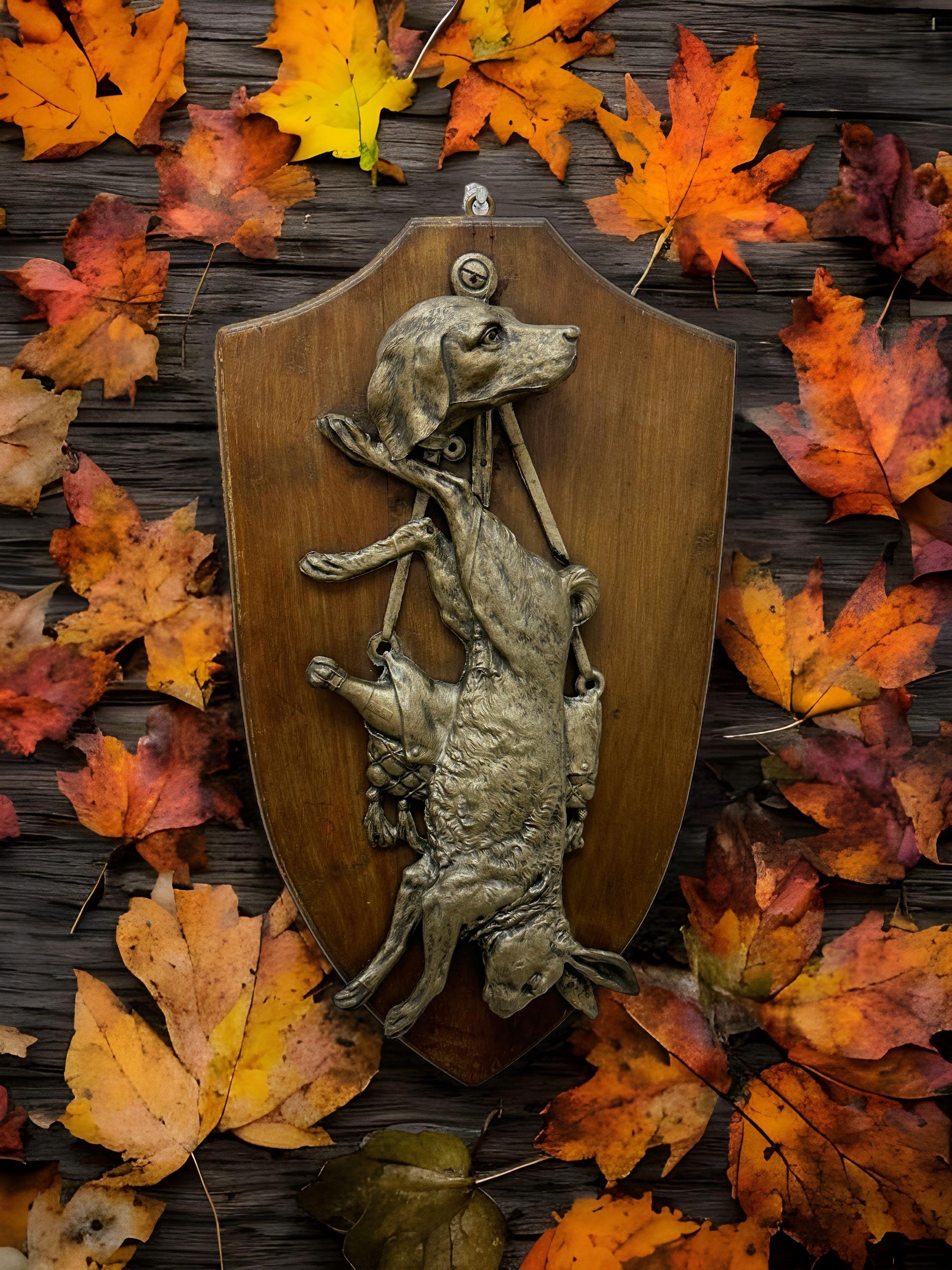 Rare antique large German metal hunt scene on a wooden wall plaque trophy depicting a Rabbit, a dog and a bag with a champagne bottle.
Wonderful Trophy of the Hunt for your Black Forest Collection. This is a truly fine older piece. 
Great lodge or
