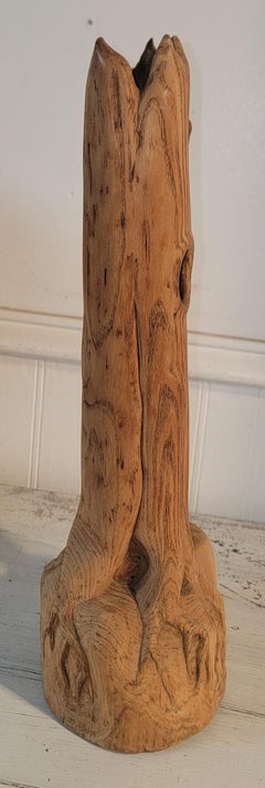 Dog Chasing a Beaver up a Tree Sculpture