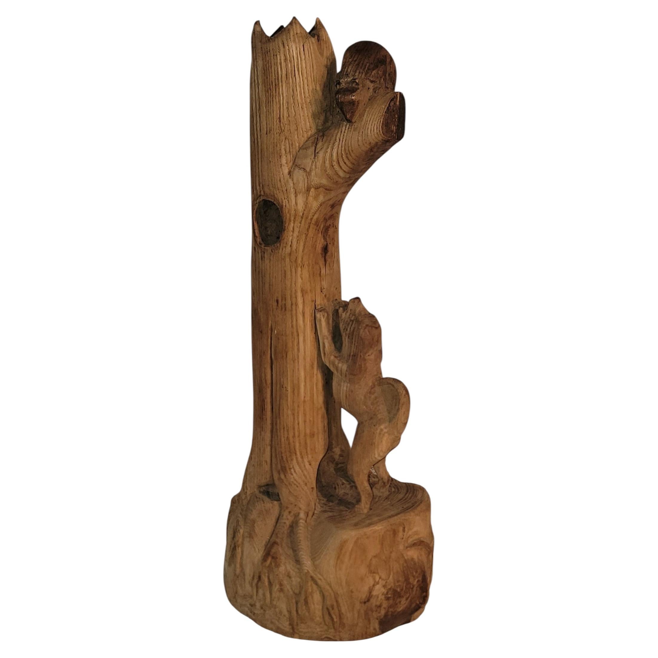 Dog Chasing a Beaver up a Tree Sculpture For Sale