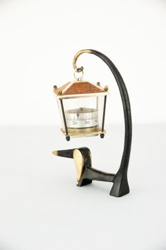 Dog Figurine Holding a Thermometer by Walter Bosse