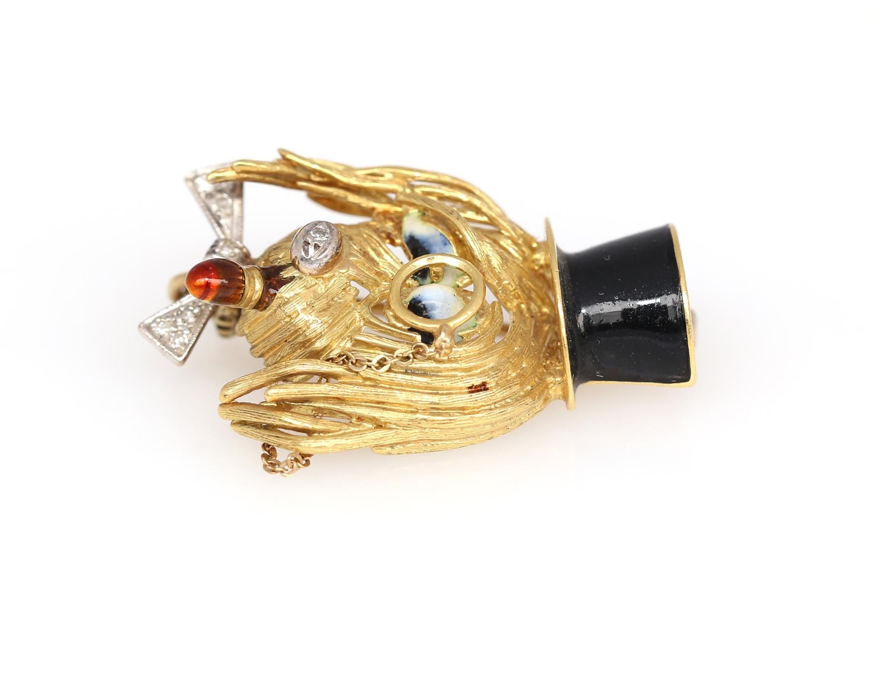 Brooch with a dog in a high hat of Black Enamel with a cigar and Diamonds on Yellow Gold. The attention to detail is just as outstanding, there is even a small chain going down from the eyeglasses.
Tiny Diamonds installed in the nose and bowtie.