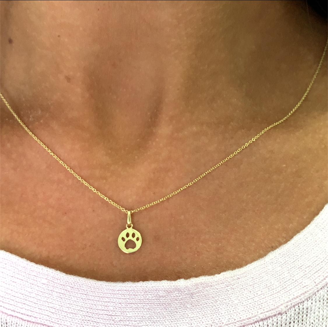 This exquisite gold pendant features a charming dog paw print design, perfect for animal lovers. Its sleek and minimalist style makes it a versatile accessory for any outfit, adding a touch of elegance and personality.
Pendant made from 9ct yellow