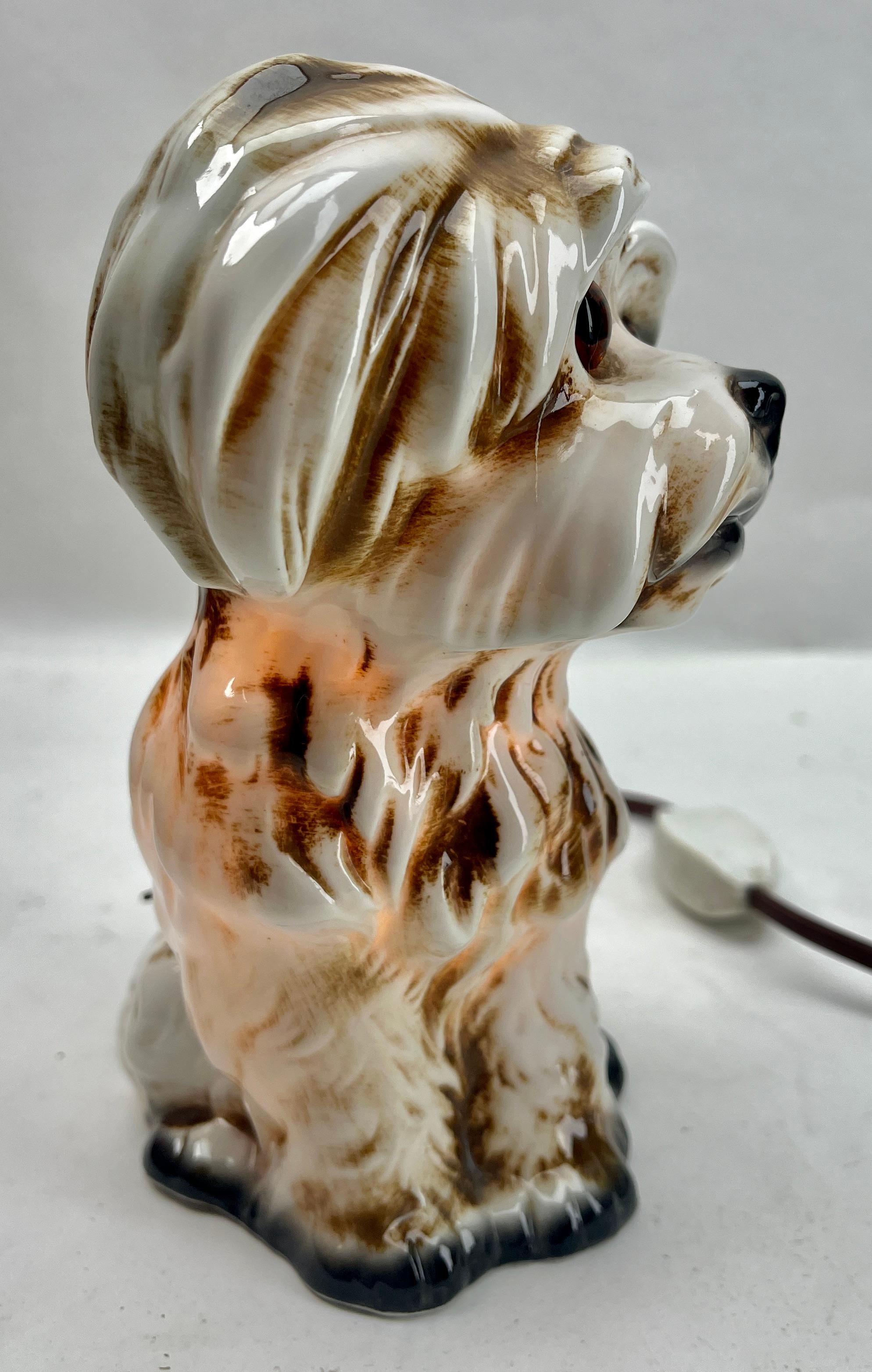 Rare and gorgeous dog perfume lamp attributed to Carl Scheidig Grafenthal, Germany.
Excellent condition, lamp is in working order.

Germany, 1930s, excellent condition
Porcelain figurine / air purifier / table lamp. Dog Frome, 1930s. Undamaged