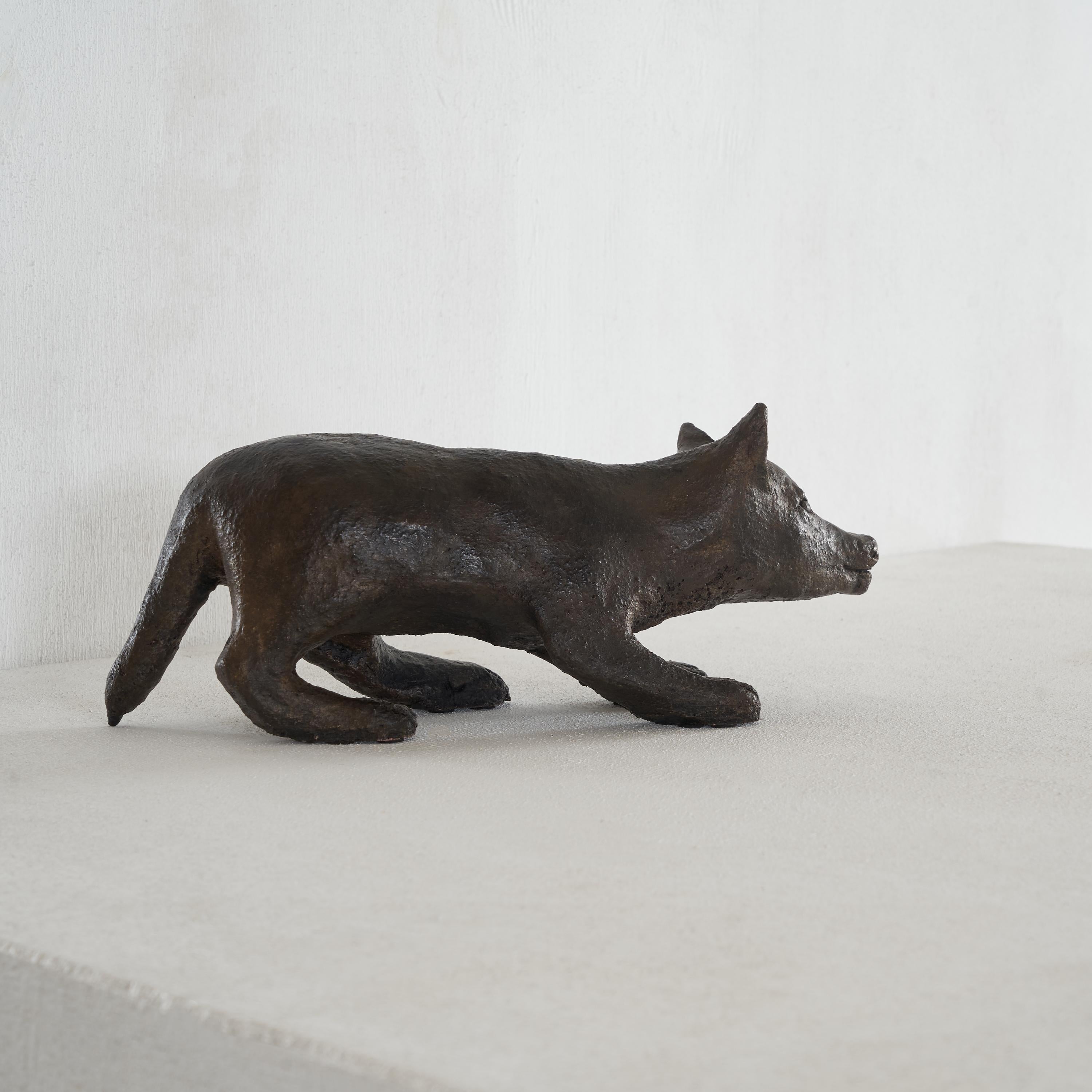 Fantastic sculpted dog in patinated clay. This dog looks great and has great presence. The sculptor captured the movement and position of a dog ready to strike perfectly. This makes it a very dynamic work that convinces from every angle.

Bronze