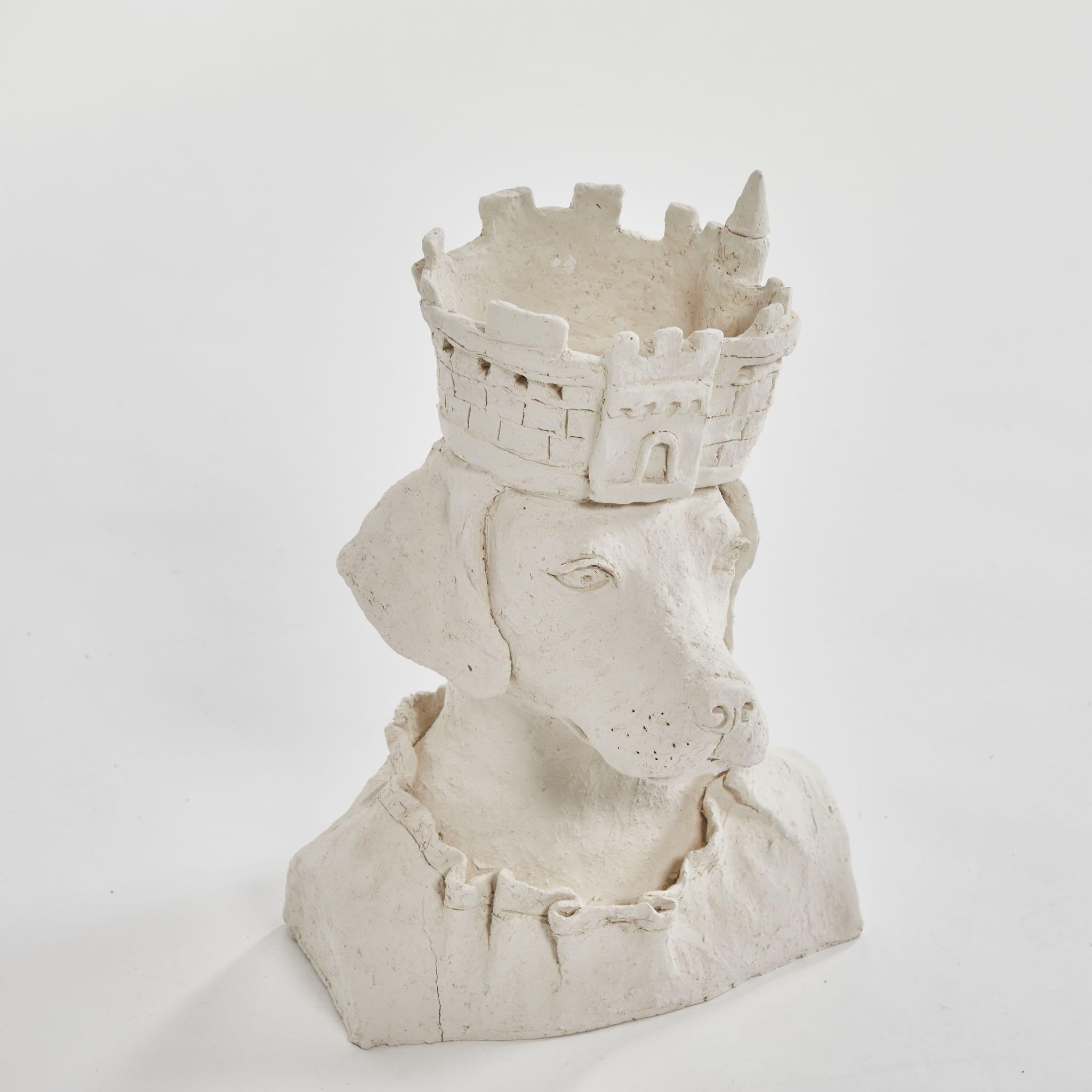 A dog sculpture with crown in plaster, originating in France, circa 2010.