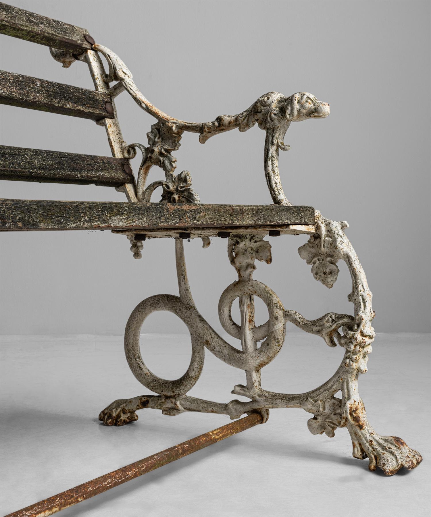Dog & Serpent Garden bench

England, Circa 1920

Garden bench with painted iron framework with serpents on the base, and dog armrests.