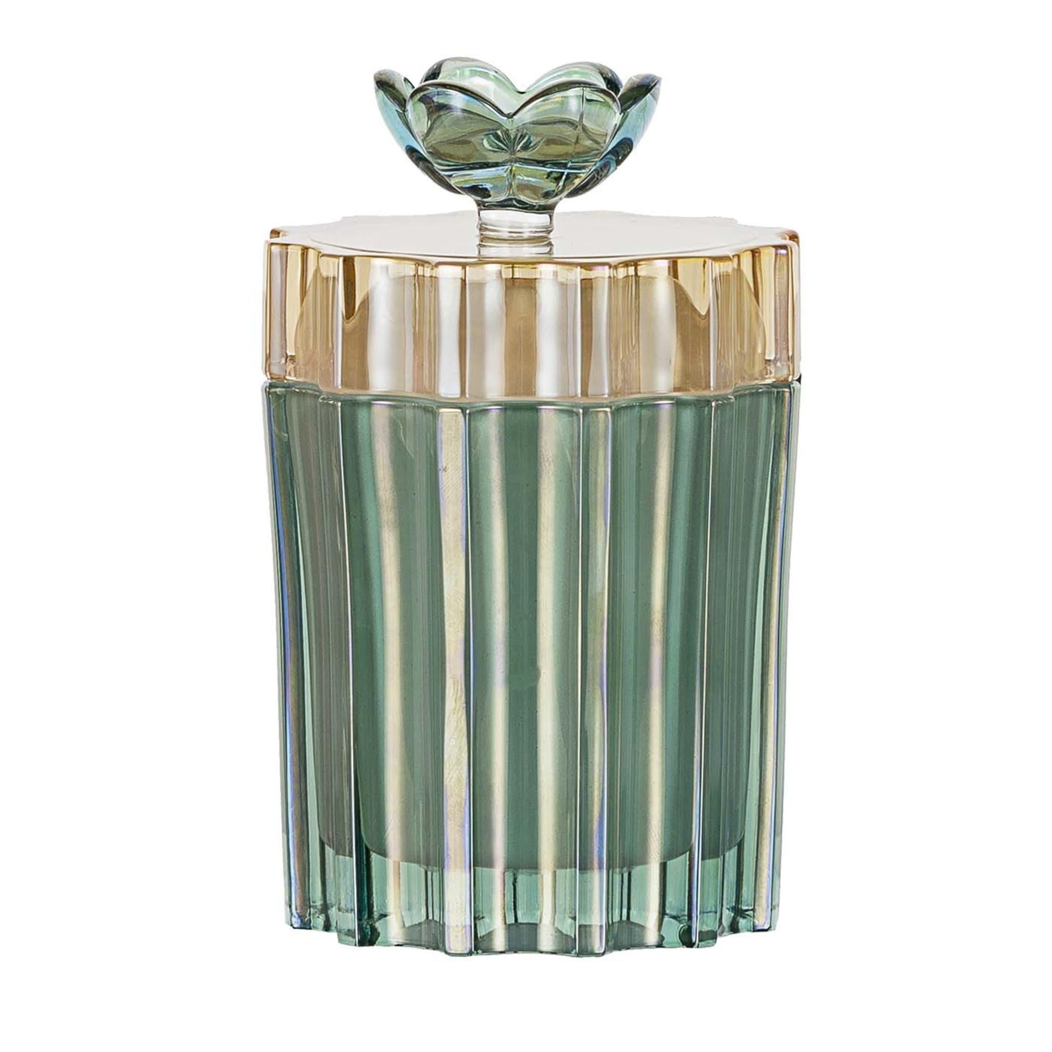 This glass box will add a colorful accent to any vanity table in a bedroom or powder room. Exquisitely decorated by hand, it is distinguished by a vertically etched pattern that creates a mesmerizing interplay of reflections on the green glass