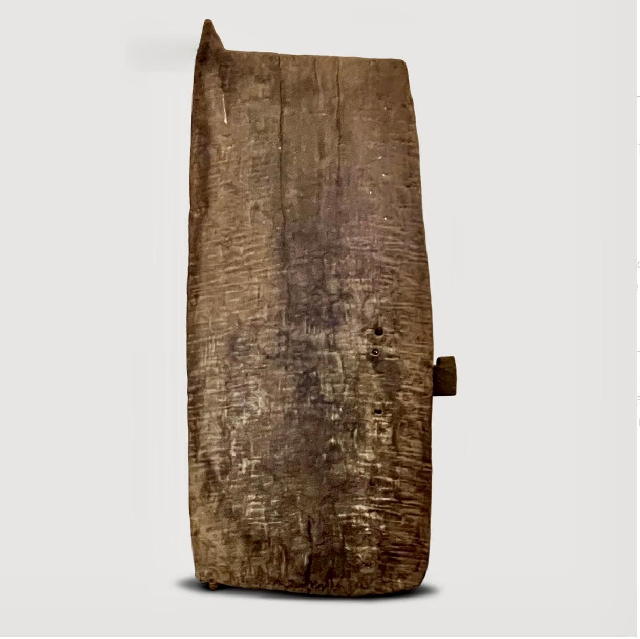 A beautiful example of a Dogon, hardwood grain door still equipped with its lock and engraved with a sober decoration in connection with the Dogon cosmogony. Beginning of the 20th century.

These doors are a significant element of Dogon architecture