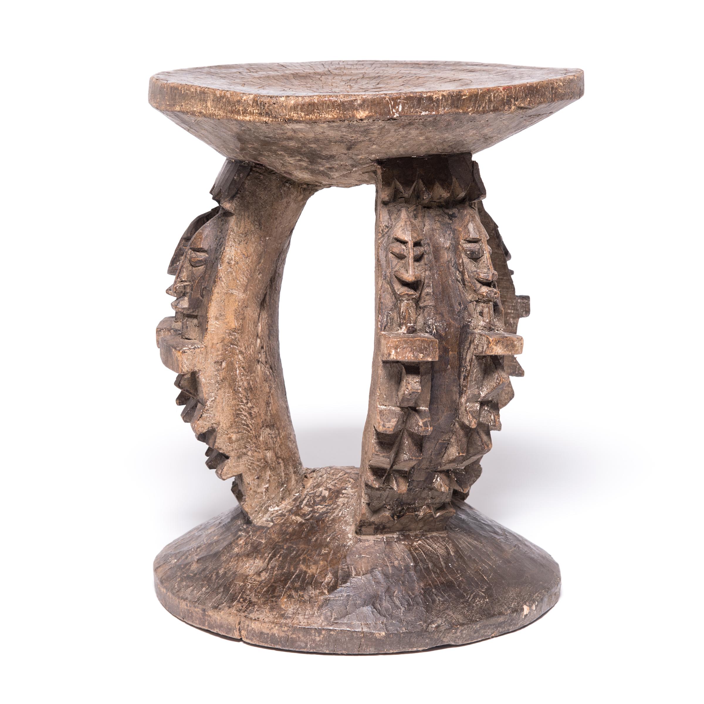 Created by the Dogon people of central Mali, this expressively carved stool continues a tradition of using stools as symbols of authority. Owning a finely made stool represented one's earned right to sit above, as befit a person of rank. Figures