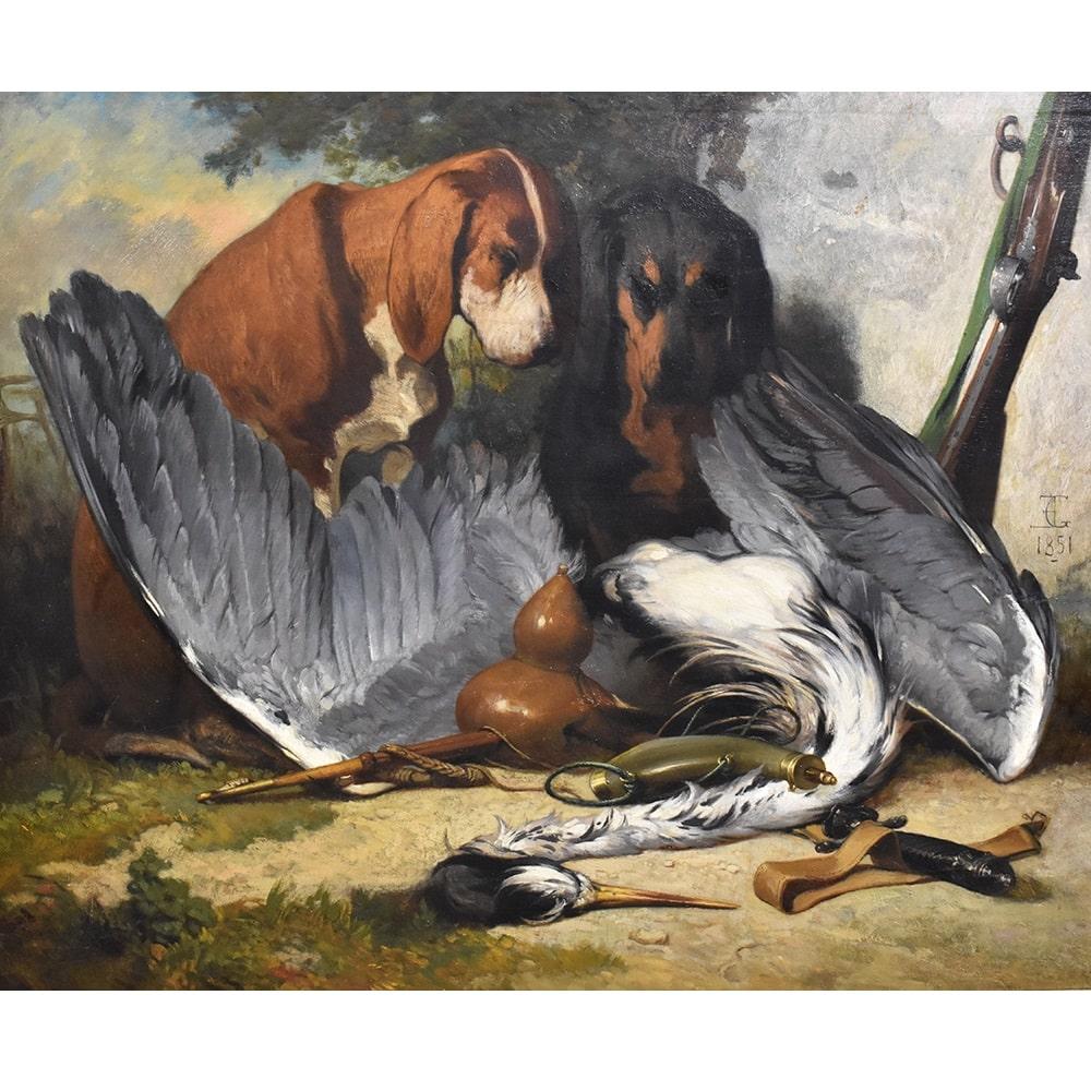 This is a portrait artwork of Two Hunting Dogs. Portraits of Dogs proposes an oil painting on wood 
with two Hounds and a Bird, from the 19th century. 
This oil painting has an original  golden frame. The old painting, XIX Century is dated 1851 and
