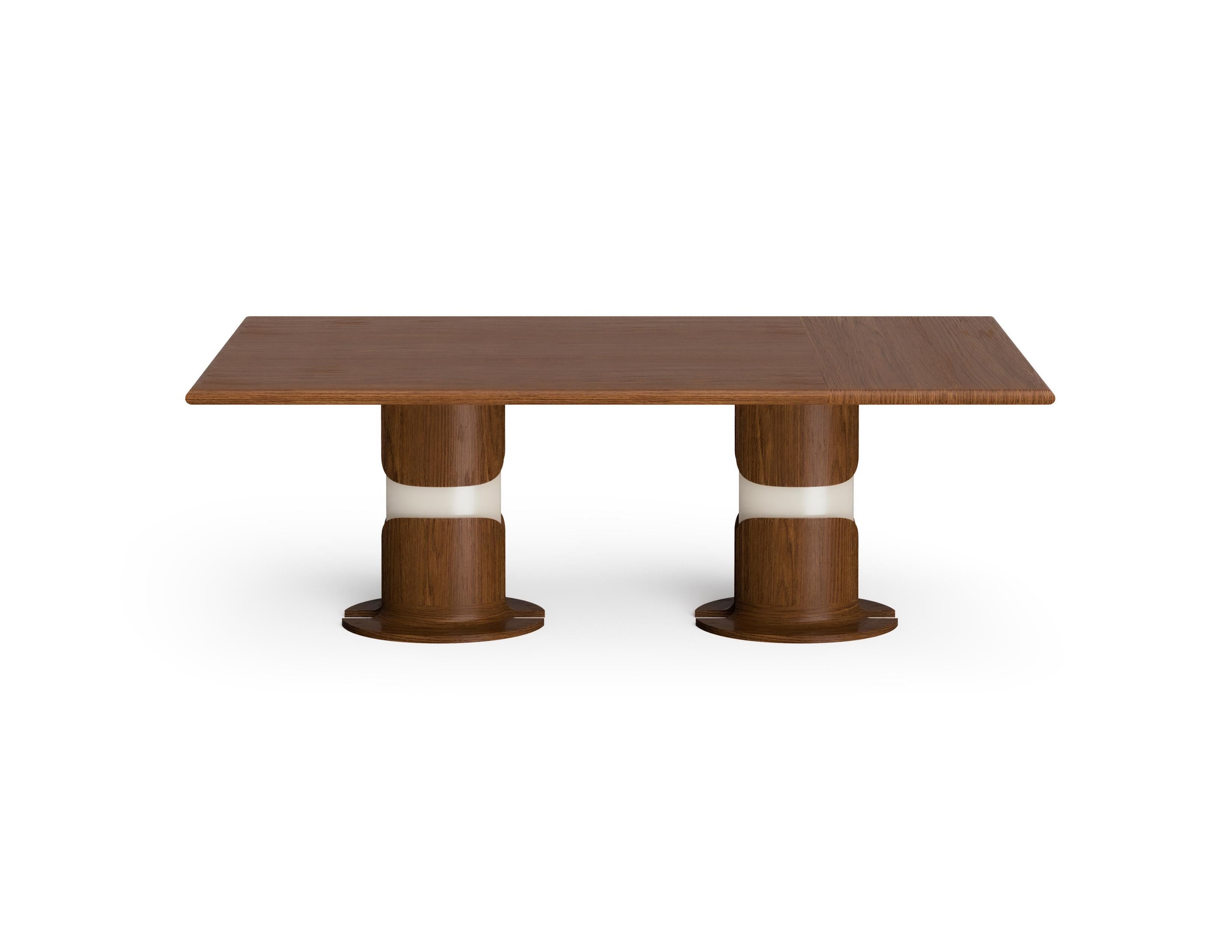 Dogum dining table displays a sculptural and powerful stance. The flower-like form of the legs symbolizes birth. The form of the lower part of the dining table consists of solid walnut, walnut veneer and glossy lacquer on wood. The dining table’s