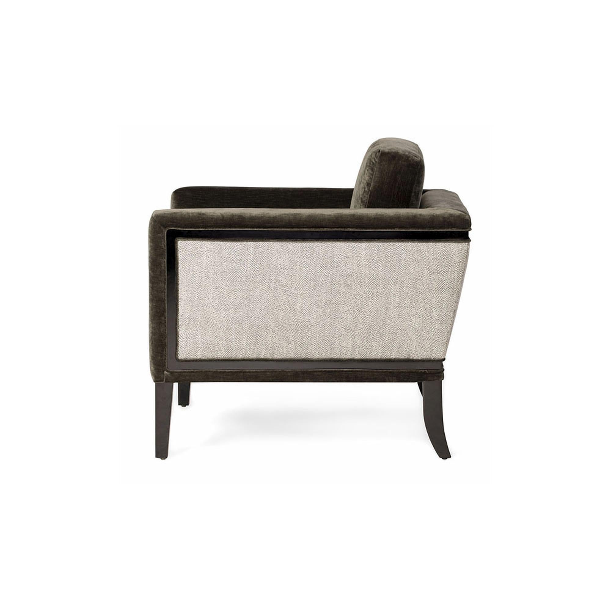 The Doheny lounge chair I bridges the gap between smaller, upright mid-century modern designs with today’s larger scale, more comfortable and stylish seating. The sleek body sits atop a lacquered wood frame and tapered legs. This chair features a